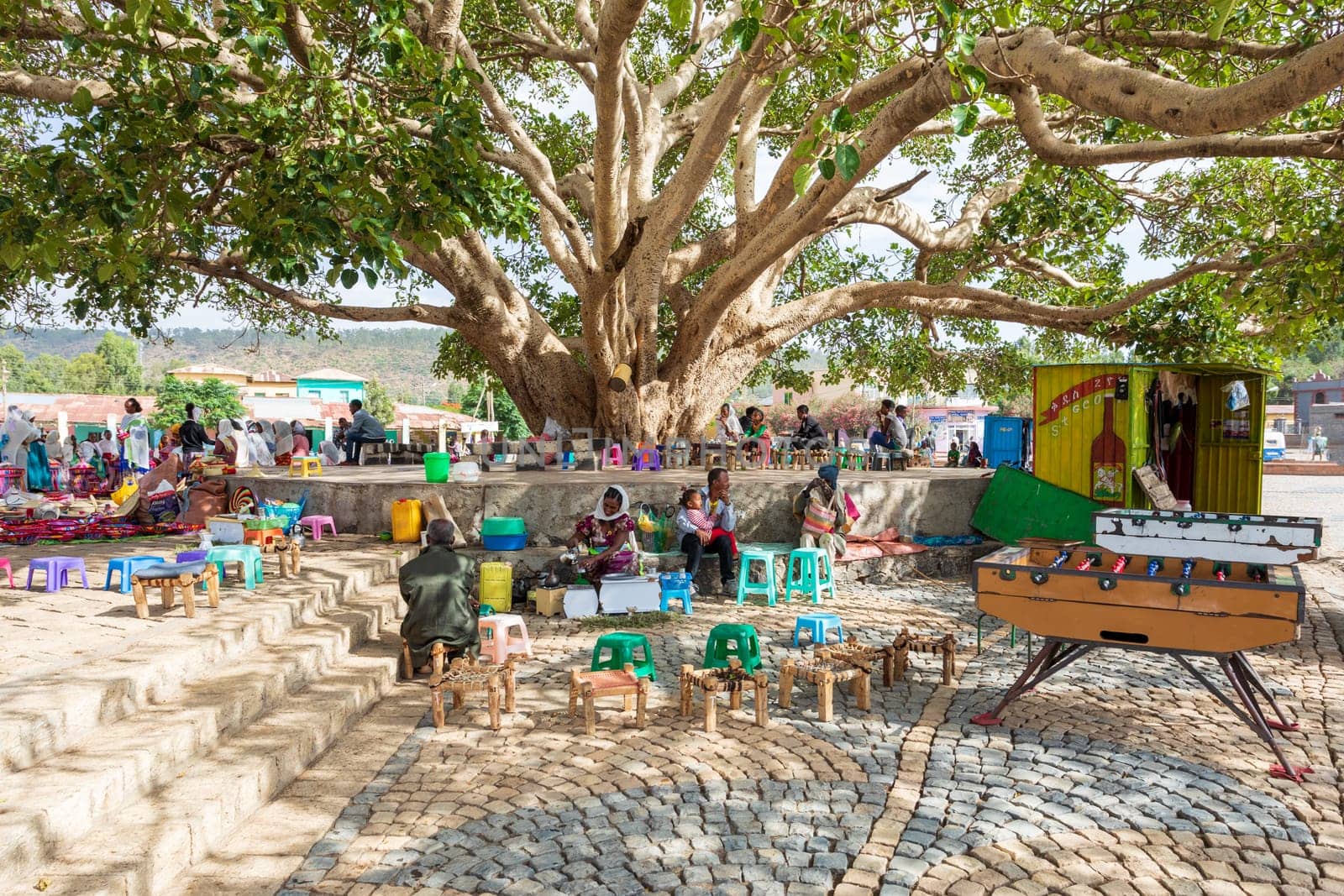 AXUM, ETHIOPIA, APRIL 27th.2019: Tigray native people resting in street market in center of Aksum on April 27, 2019 in Aksum, Tigray, Ethiopia Africa