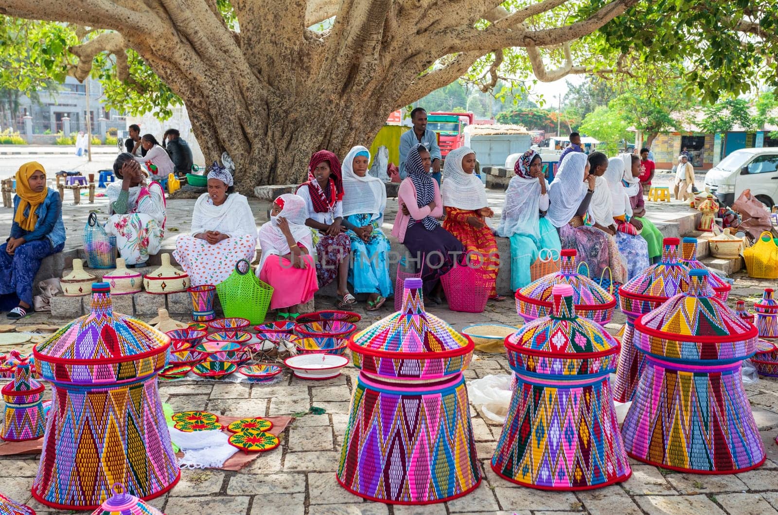 AXUM, ETHIOPIA, APRIL 27th.2019: Carefree tigray native woman resting in street market in center of Aksum on April 27, 2019 in Aksum, Tigray, Ethiopia Africa