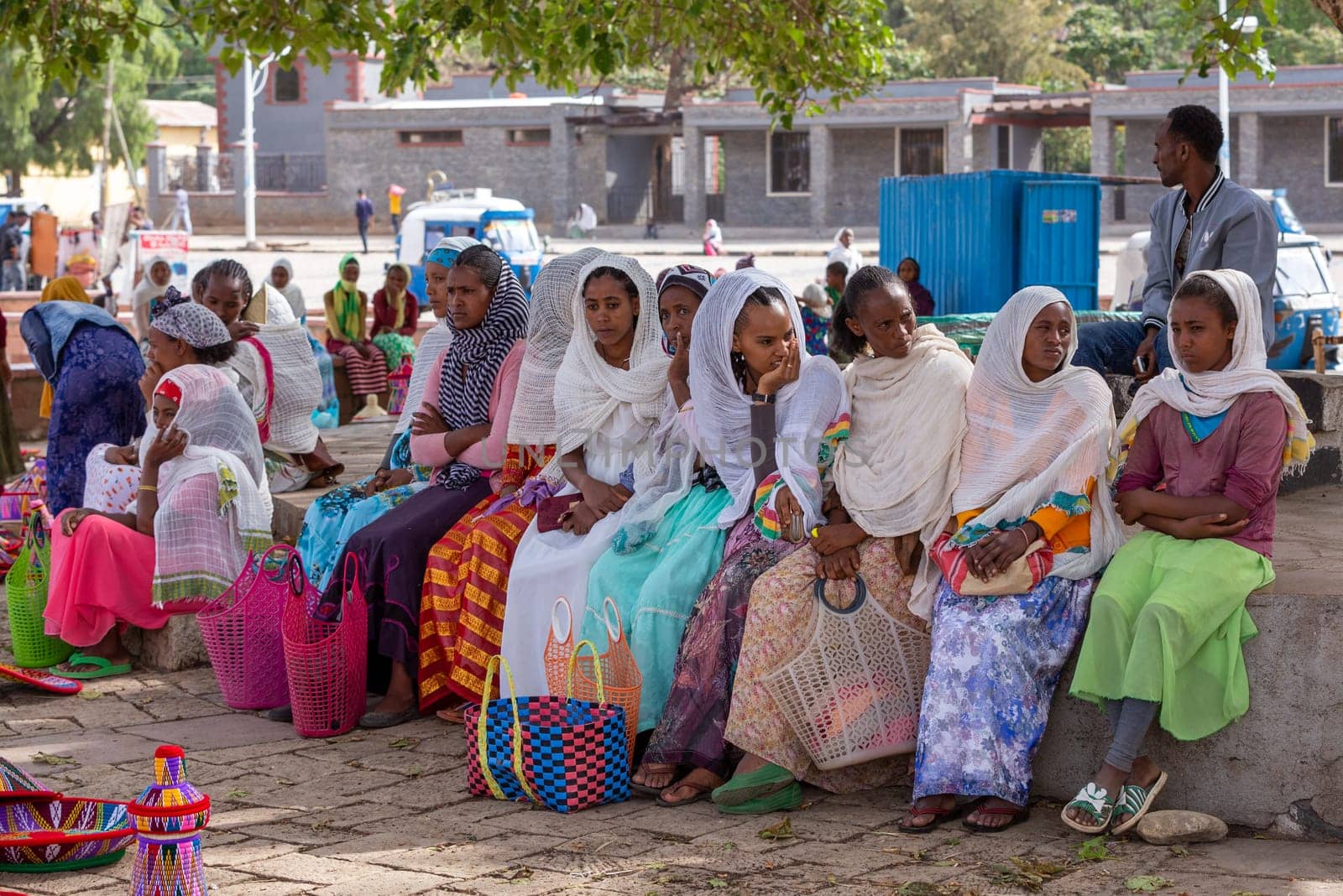 AXUM, ETHIOPIA, APRIL 27th.2019: Carefree tigray native woman resting in street market in center of Aksum on April 27, 2019 in Aksum, Tigray, Ethiopia Africa