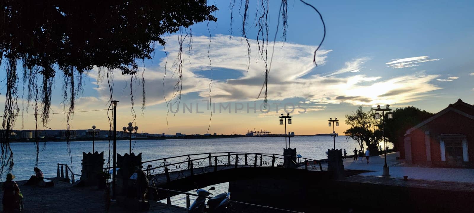 Tamsui, NEW TAIPEI CITY, TAIWAN - Sep 8, 2021 - City Tamsui Bali District in Taipei, Taiwan reflecting in the Tamsui River at nice day