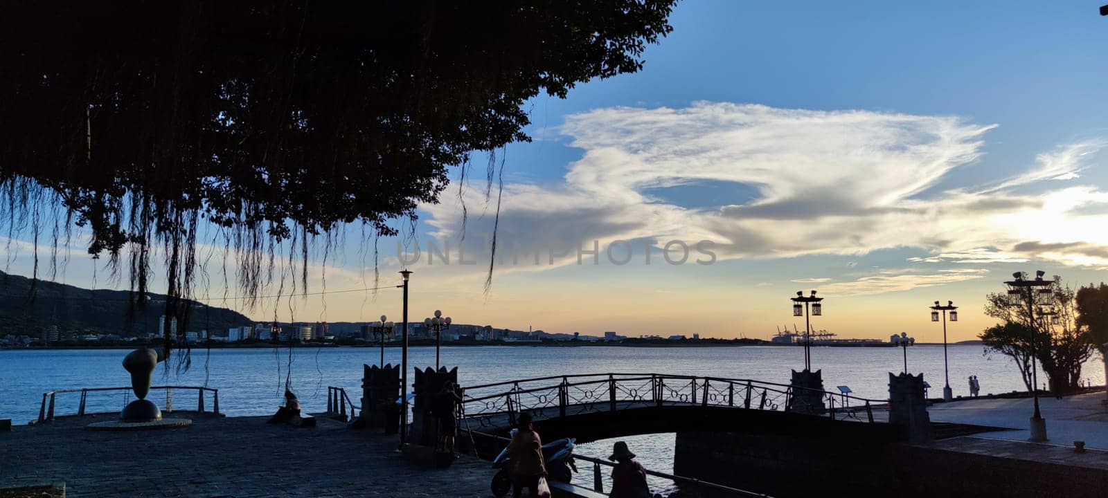 Tamsui, NEW TAIPEI CITY, TAIWAN - Sep 8, 2021 - City Tamsui Bali District in Taipei, Taiwan reflecting in the Tamsui River at nice day