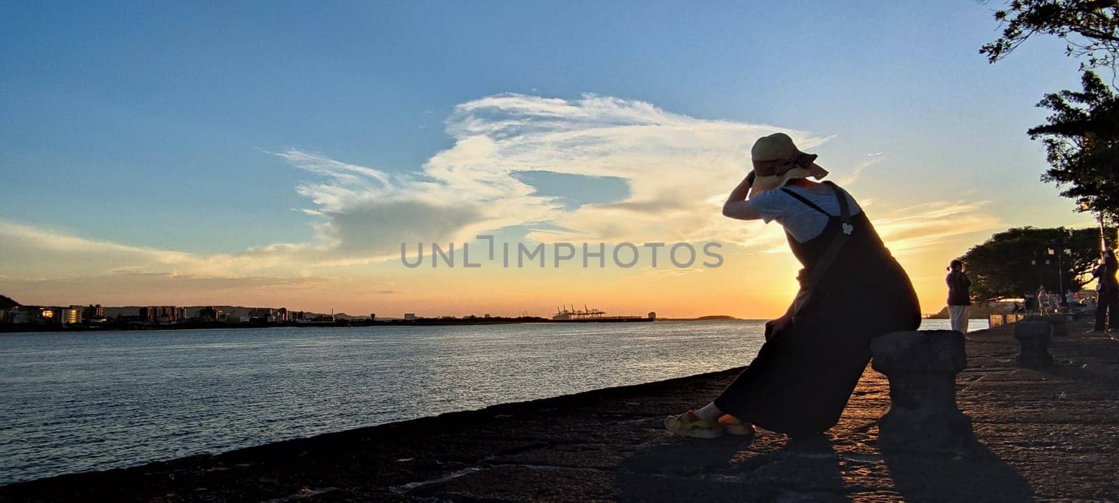 Tamsui, NEW TAIPEI CITY, TAIWAN - Sep 8, 2021 - City Tamsui Bali District in Taipei, Taiwan reflecting in the Tamsui River at nice day