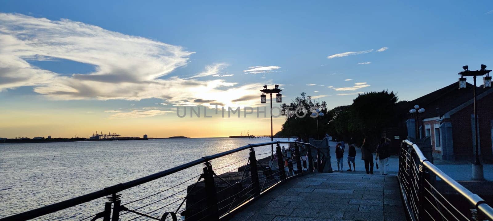 Tamsui, NEW TAIPEI CITY, TAIWAN - Sep 8, 2021 - City Tamsui Bali District in Taipei, Taiwan reflecting in the Tamsui River at nice day