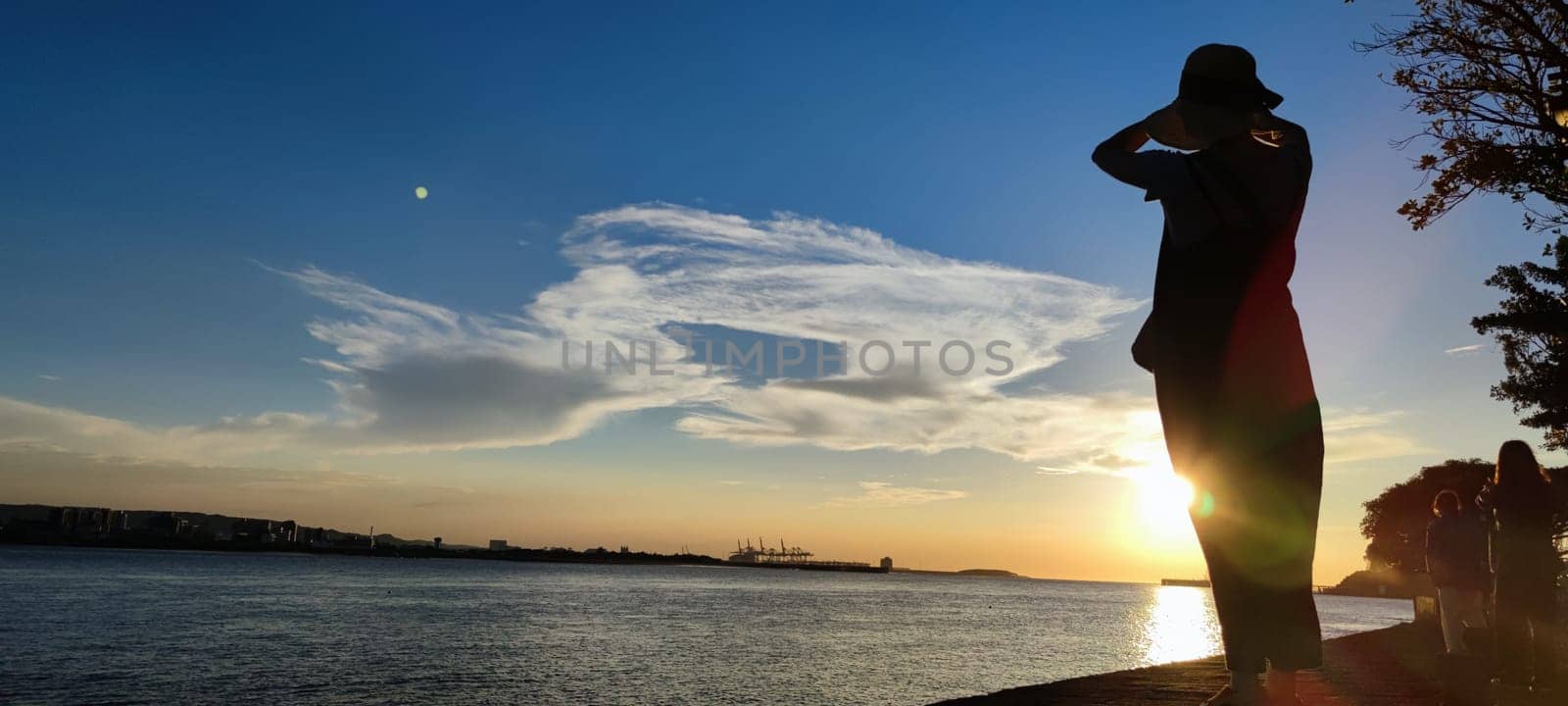 Tamsui, NEW TAIPEI CITY, TAIWAN - Sep 8, 2021 - City Tamsui Bali District in Taipei, Taiwan reflecting in the Tamsui River at nice day