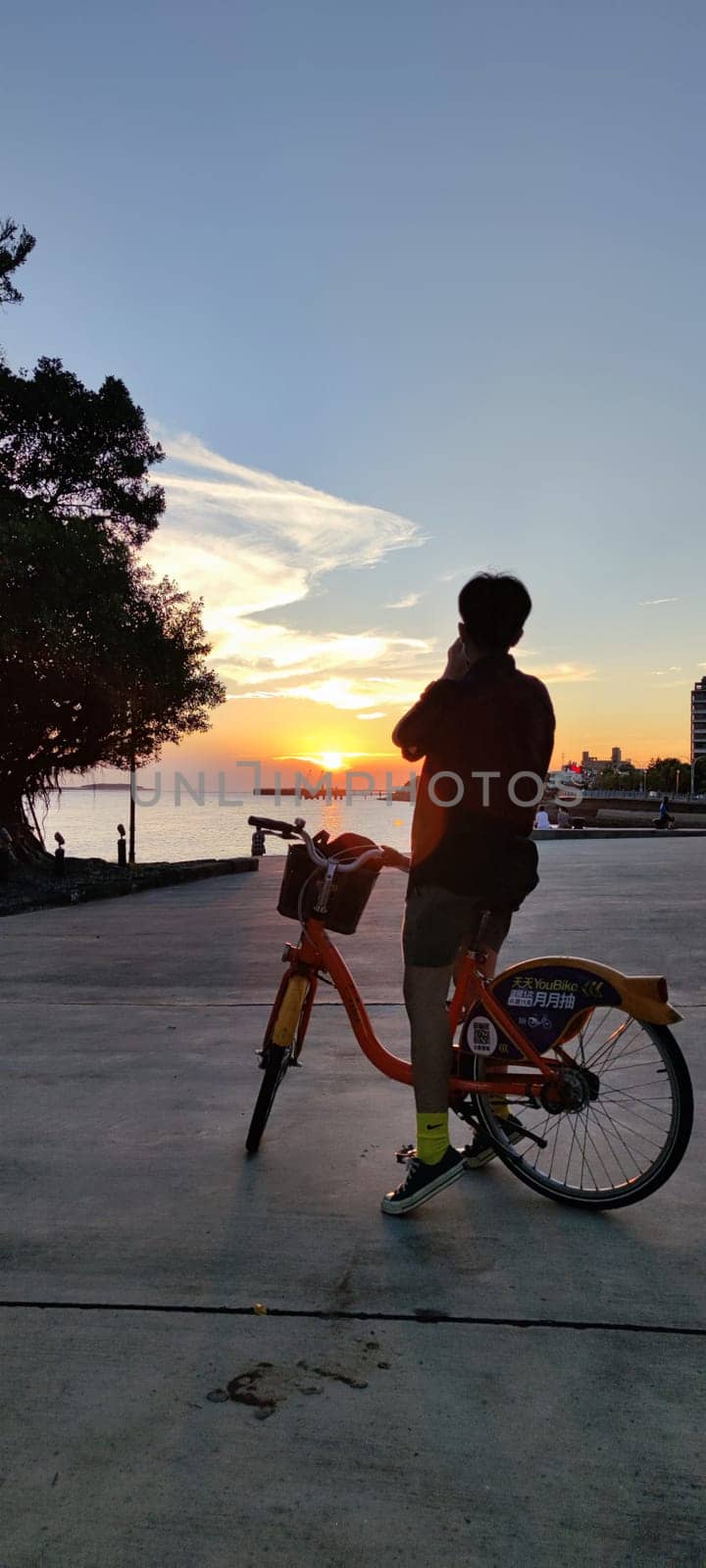 Tamsui, NEW TAIPEI CITY, TAIWAN - Sep 8, 2021 - City Tamsui Bali District in Taipei, Taiwan reflecting in the Tamsui River at nice day