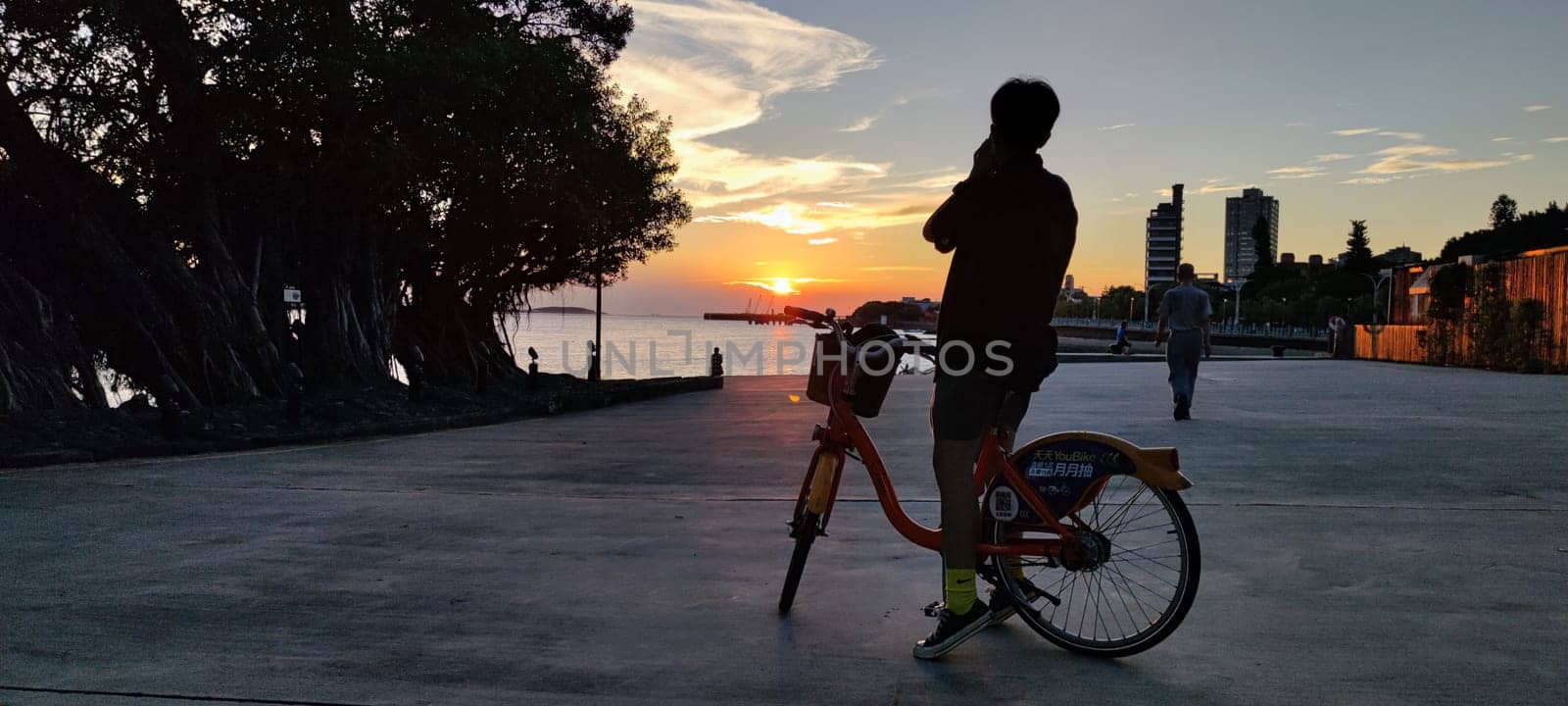 Tamsui, NEW TAIPEI CITY, TAIWAN - Sep 8, 2021 - City Tamsui Bali District in Taipei, Taiwan reflecting in the Tamsui River at nice day