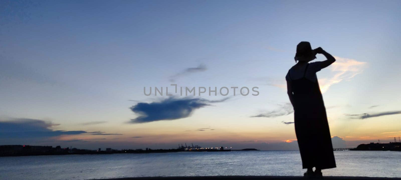 Tamsui, NEW TAIPEI CITY, TAIWAN - Sep 8, 2021 - City Tamsui Bali District in Taipei, Taiwan reflecting in the Tamsui River at nice day