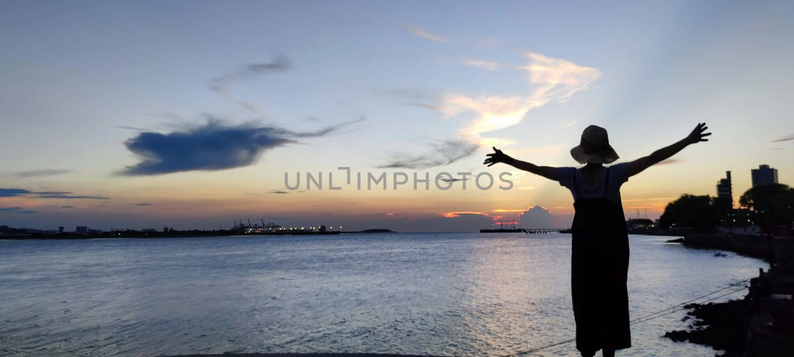 Tamsui, NEW TAIPEI CITY, TAIWAN - Sep 8, 2021 - City Tamsui Bali District in Taipei, Taiwan reflecting in the Tamsui River at nice day