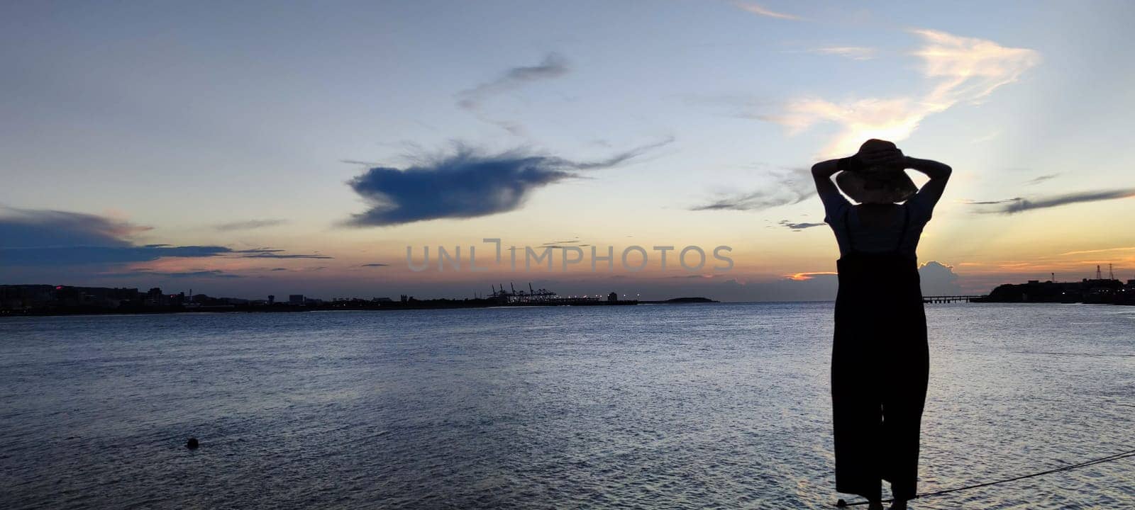 Tamsui, NEW TAIPEI CITY, TAIWAN - Sep 8, 2021 - City Tamsui Bali District in Taipei, Taiwan reflecting in the Tamsui River at nice day