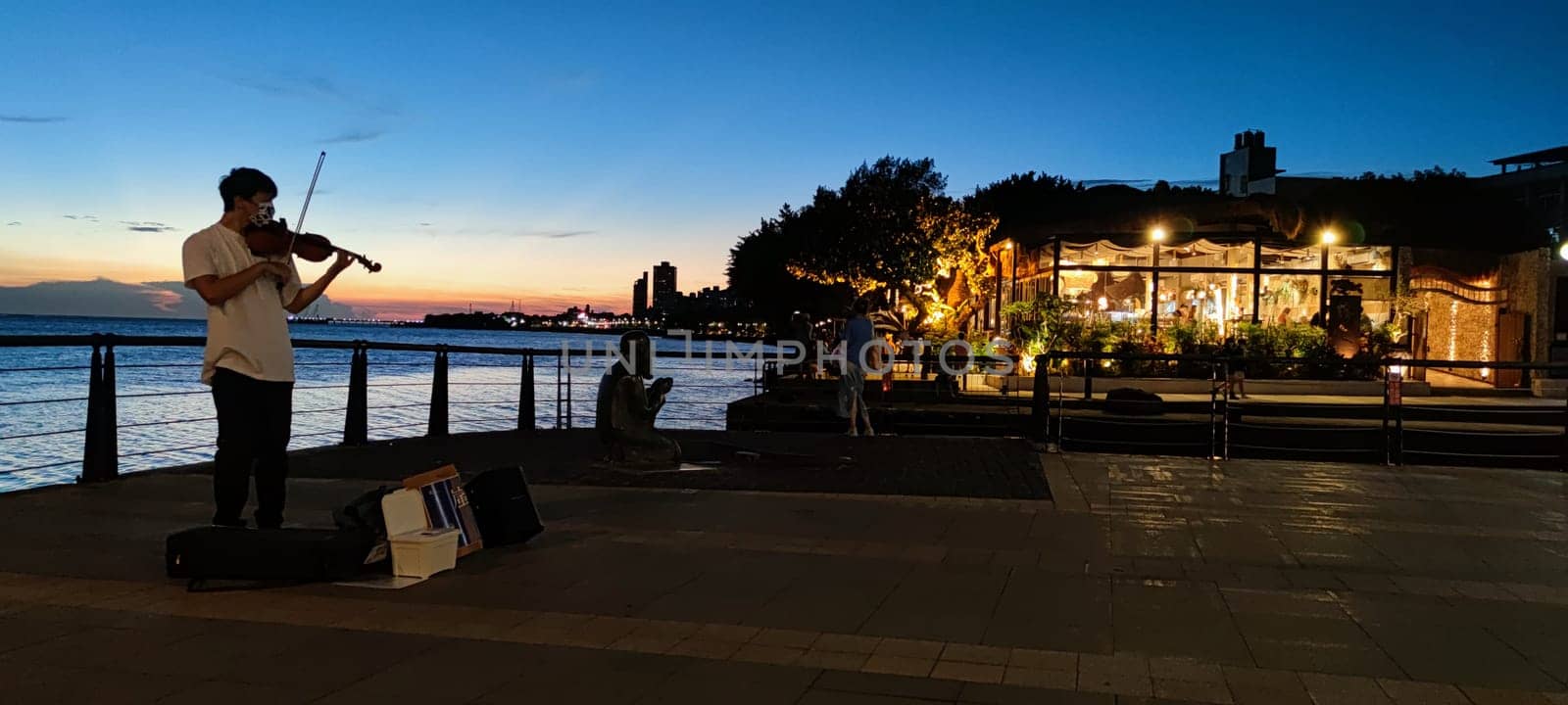 Tamsui, NEW TAIPEI CITY, TAIWAN - Sep 8, 2021 - City Tamsui Bali District in Taipei, Taiwan reflecting in the Tamsui River at nice day