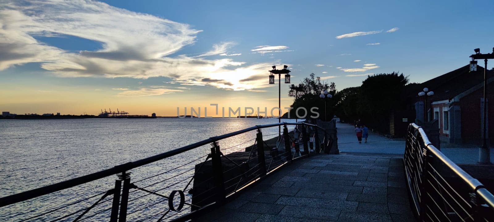 Tamsui, NEW TAIPEI CITY, TAIWAN - Sep 8, 2021 - City Tamsui Bali District in Taipei, Taiwan reflecting in the Tamsui River at nice day