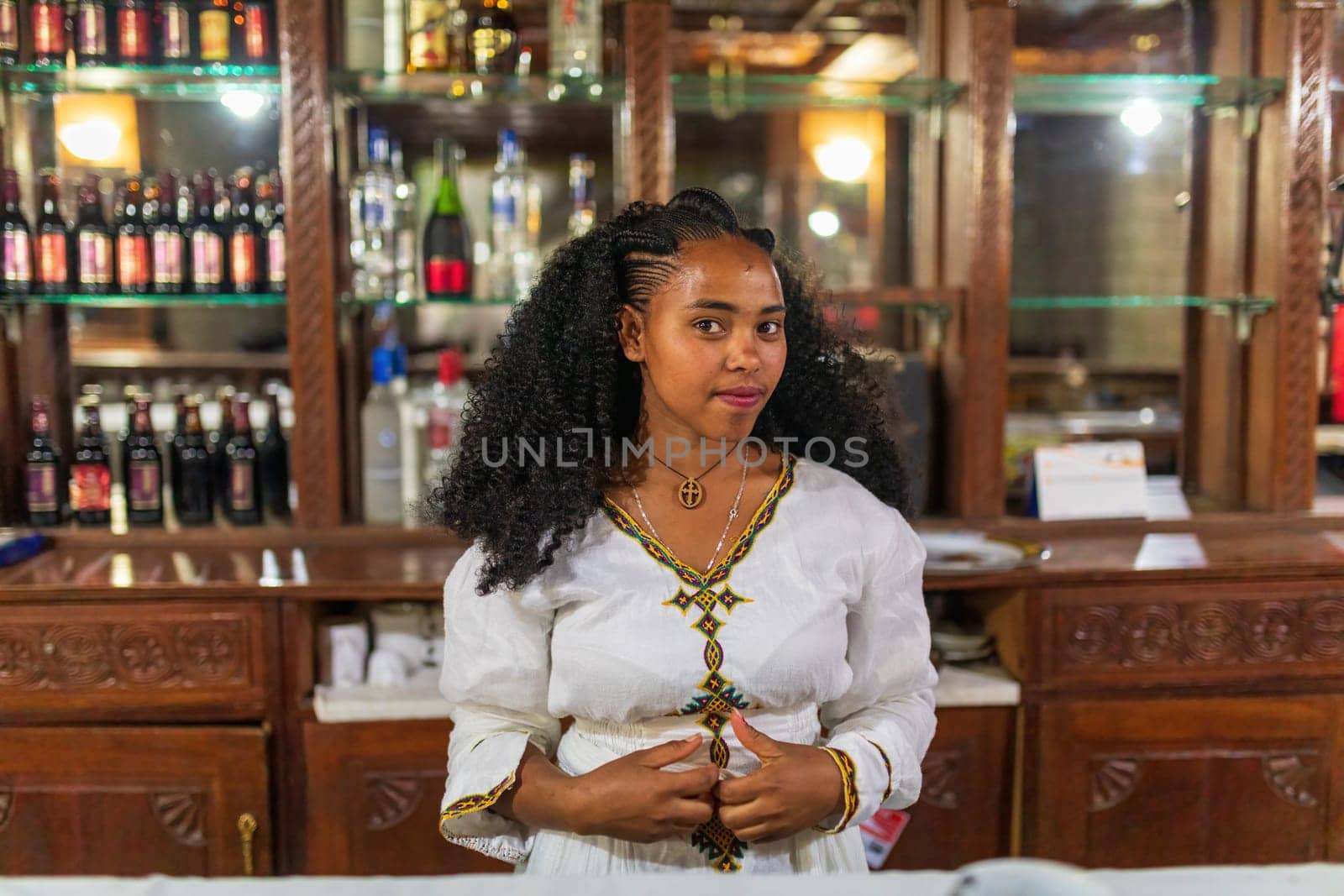 Mekele, Ethiopia - April 28, 2019: Ethiopian beautiful barmaid woman with traditional hair style in Mekelle, second largest city and capital of Tigray region, in Ethiopia Africa