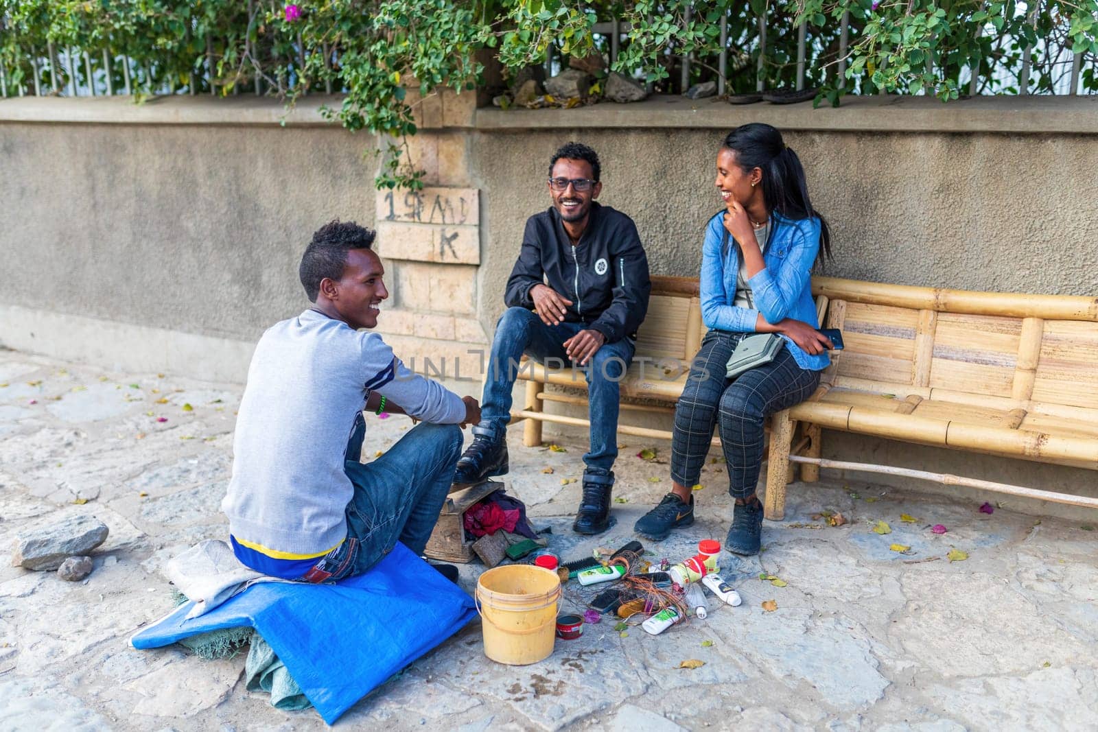 Mekele, Ethiopia - April 28, 2019: young Ethiopians with shoe polisher on the street in Mekelle, second largest city and capital of Tigray region, in Ethiopia Africa