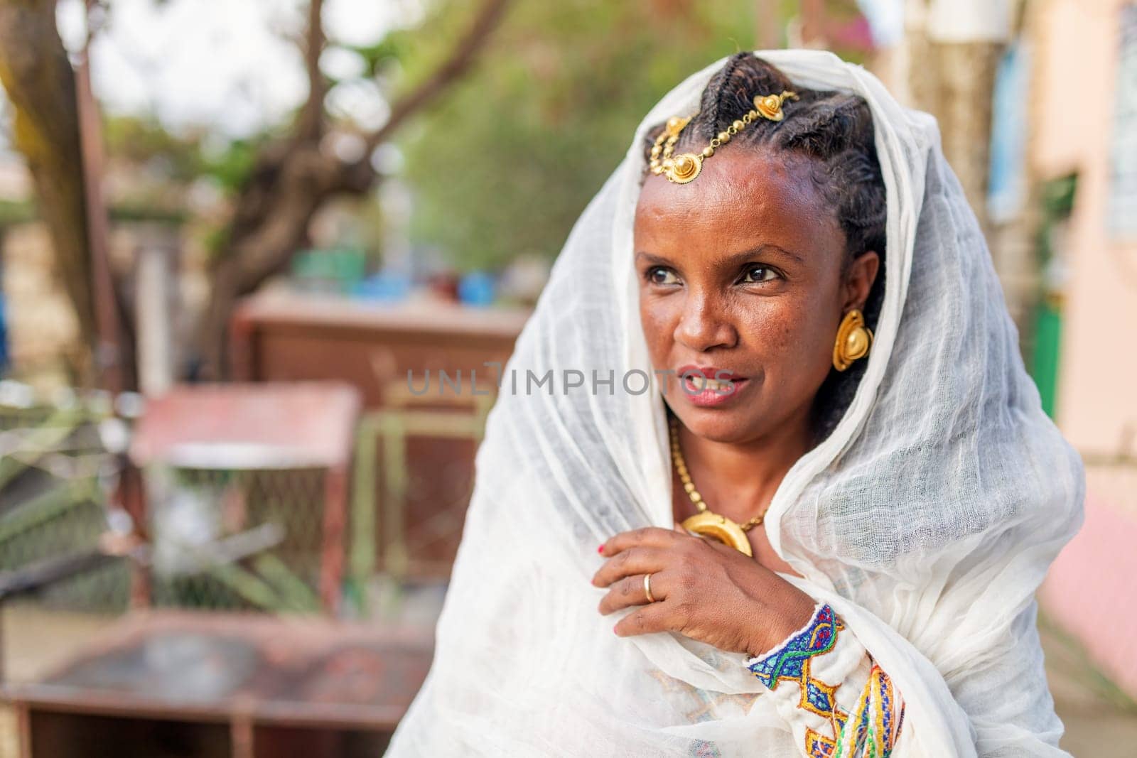 Mekelle, Ethiopia - April 28, 2019: Ethiopian beautiful woman with traditional costume on the street in Mekelle, second largest city and capital of Tigray region, in Ethiopia Africa