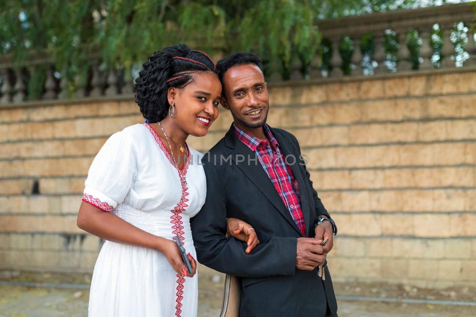 Mekele, Ethiopia - April 28, 2019: Ethiopian beautiful woman with traditional costume with husband on the street in Mekelle, second largest city and capital of Tigray region, Ethiopia Africa