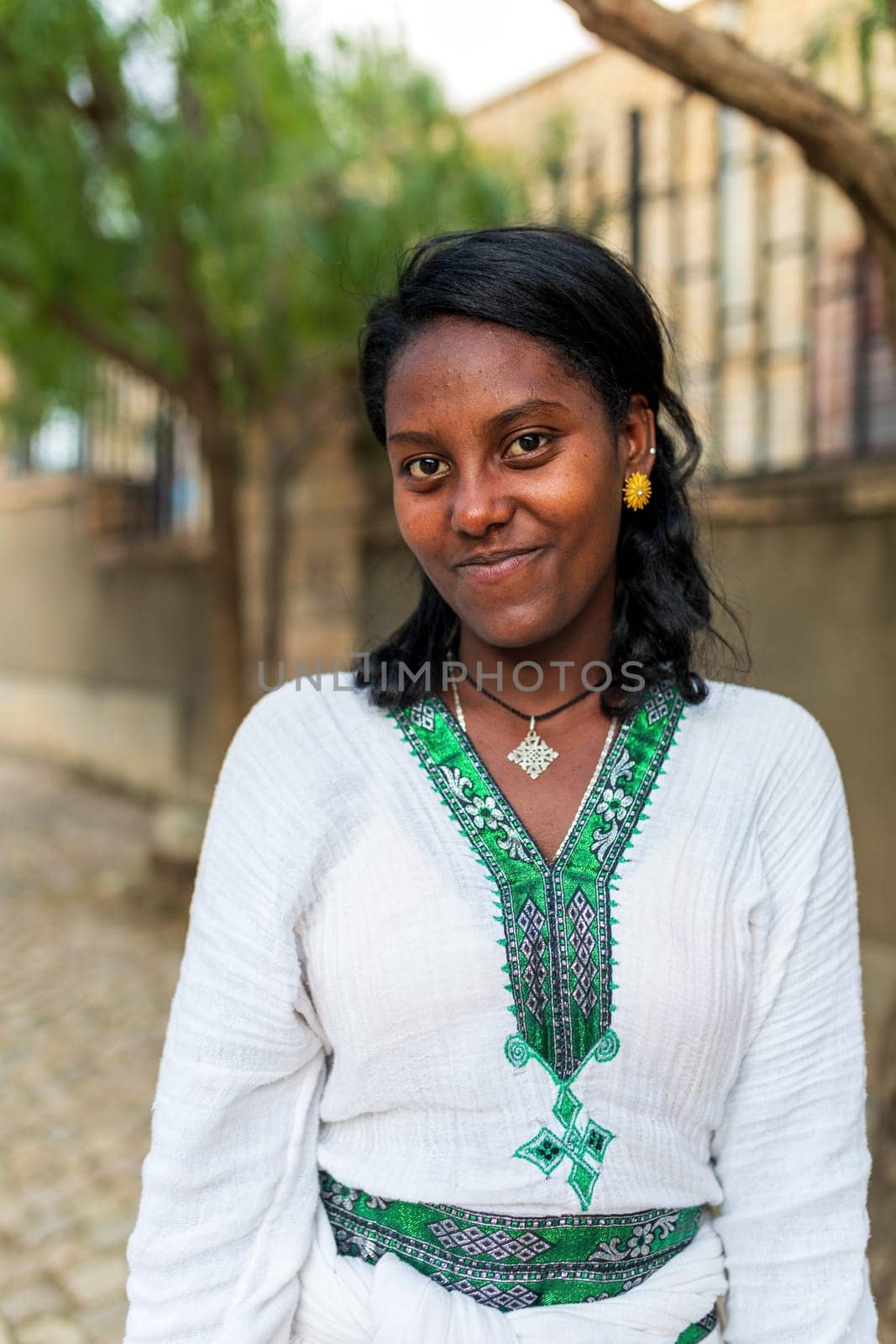 Mekelle, Ethiopia - April 28, 2019: Ethiopian beautiful woman with traditional costume on the street in Mekelle, second largest city and capital of Tigray region, in Ethiopia Africa