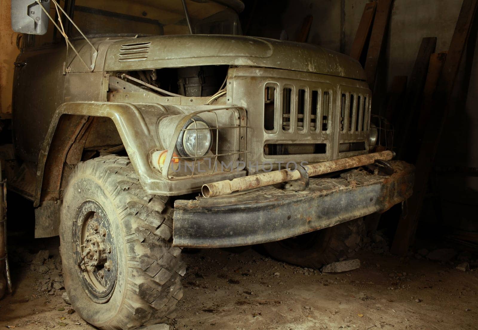 old army green truck close up at night