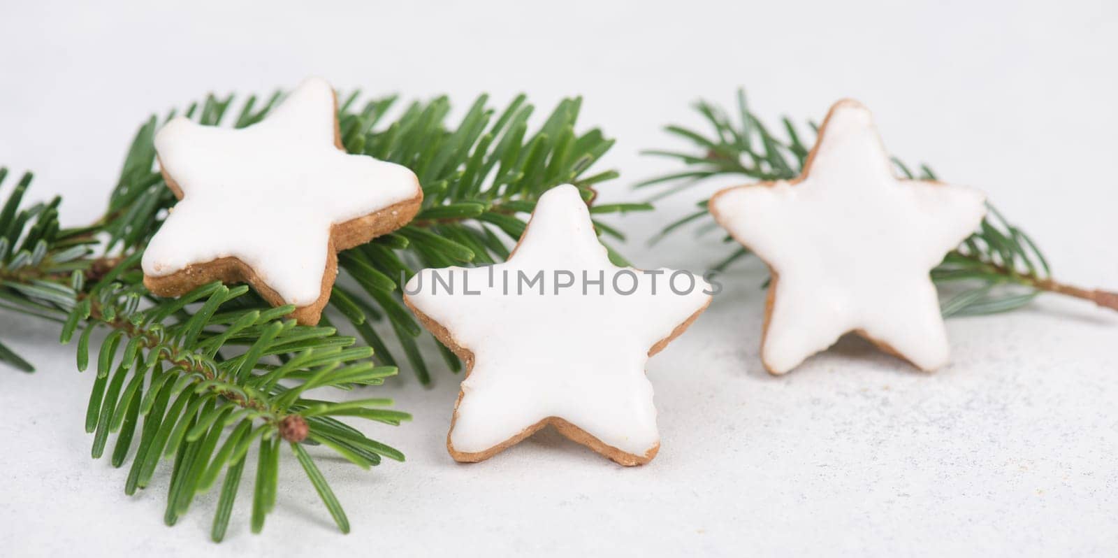 Cinnamon stars, traditional german christmas cookies, gingerbread, empty copy space, fir branch