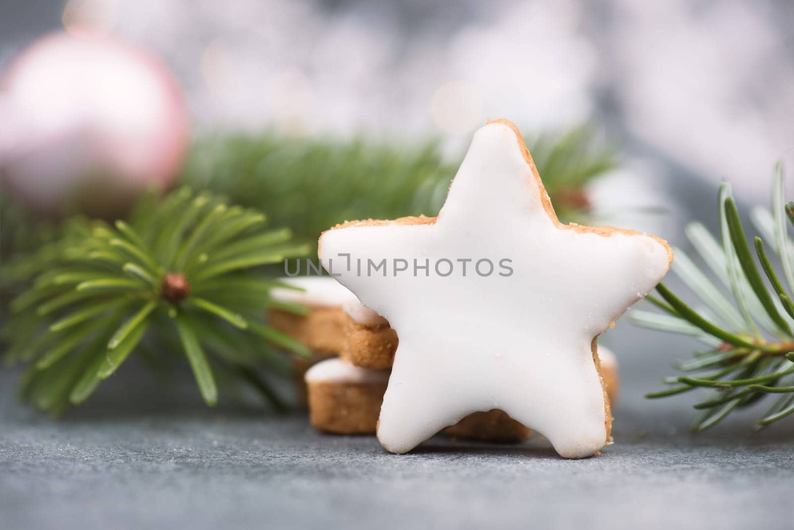 Cinnamon stars, traditional german christmas cookies, gingerbread, empty copy space, fir branch