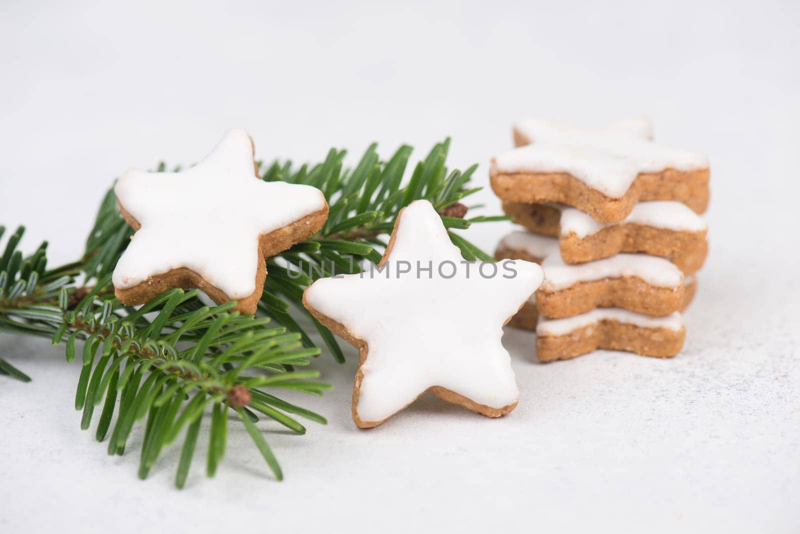 Cinnamon stars, traditional german christmas cookies, gingerbread, empty copy space, fir branch