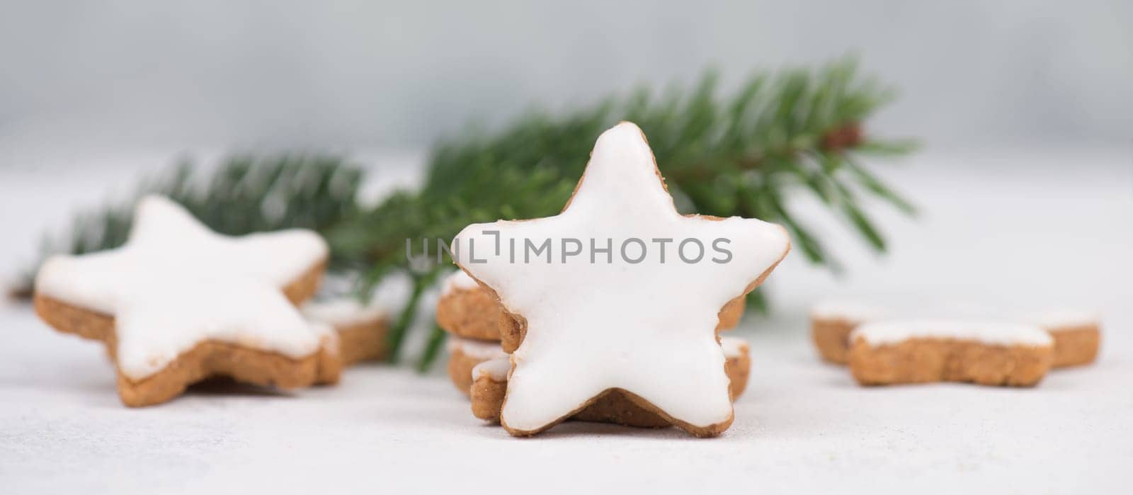 Cinnamon stars, traditional german christmas cookies, gingerbread, empty copy space, fir branch