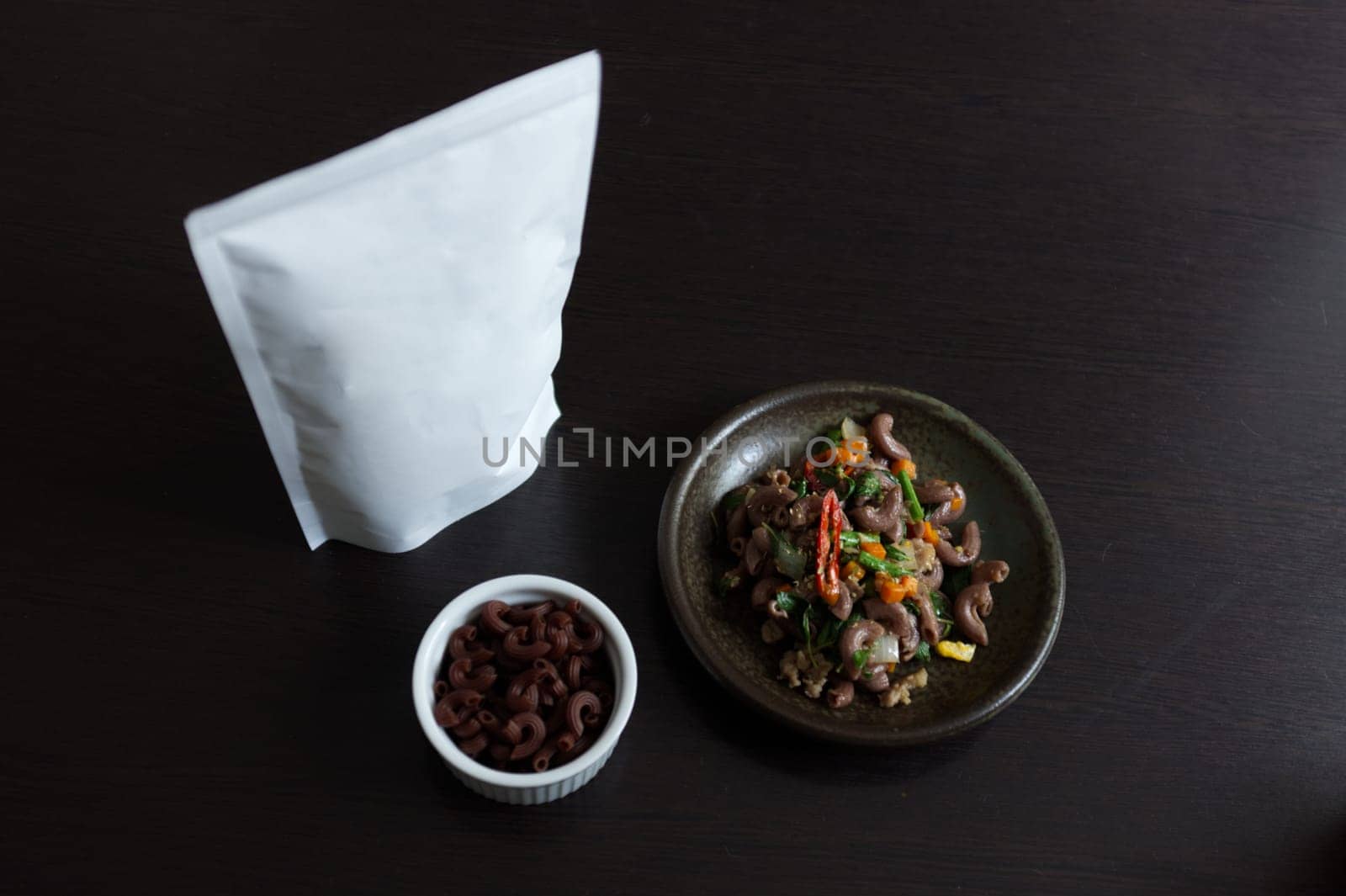 Macaroni with spicy with basil and minced pork . white space package for text