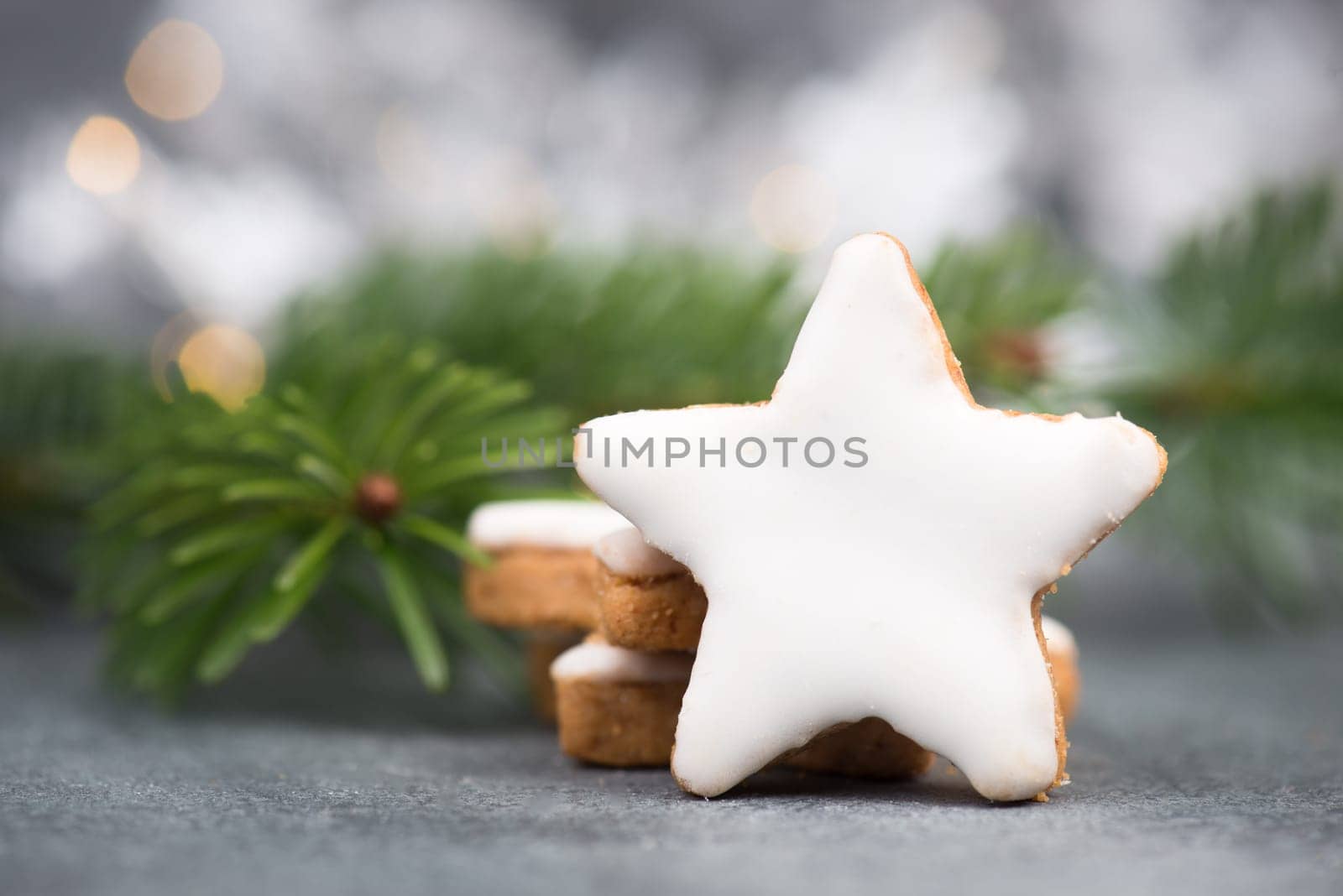 Cinnamon stars, traditional german christmas cookies, gingerbread, empty copy space, fir branch