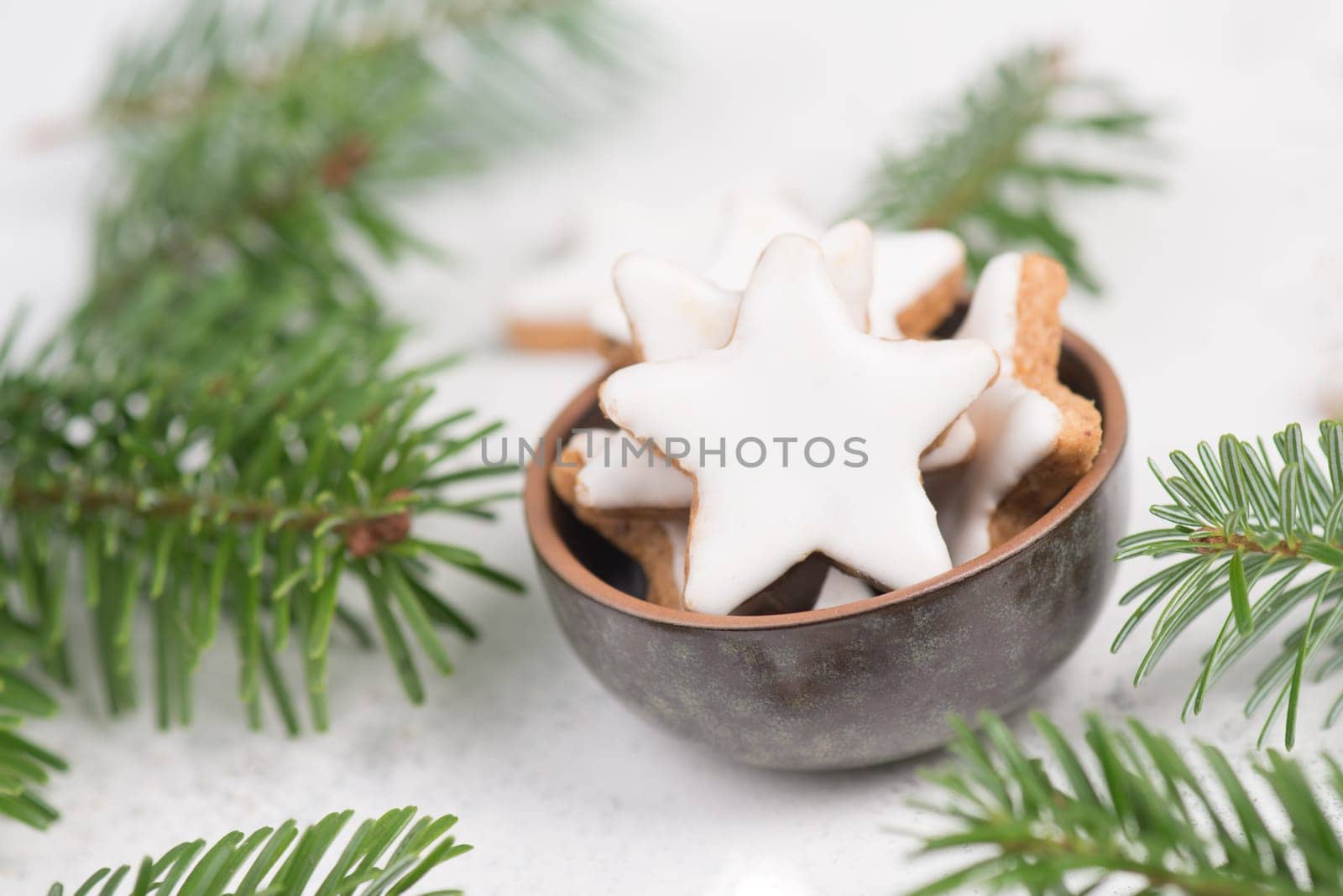 Cinnamon stars, traditional german christmas cookies, gingerbread, empty copy space, fir branch