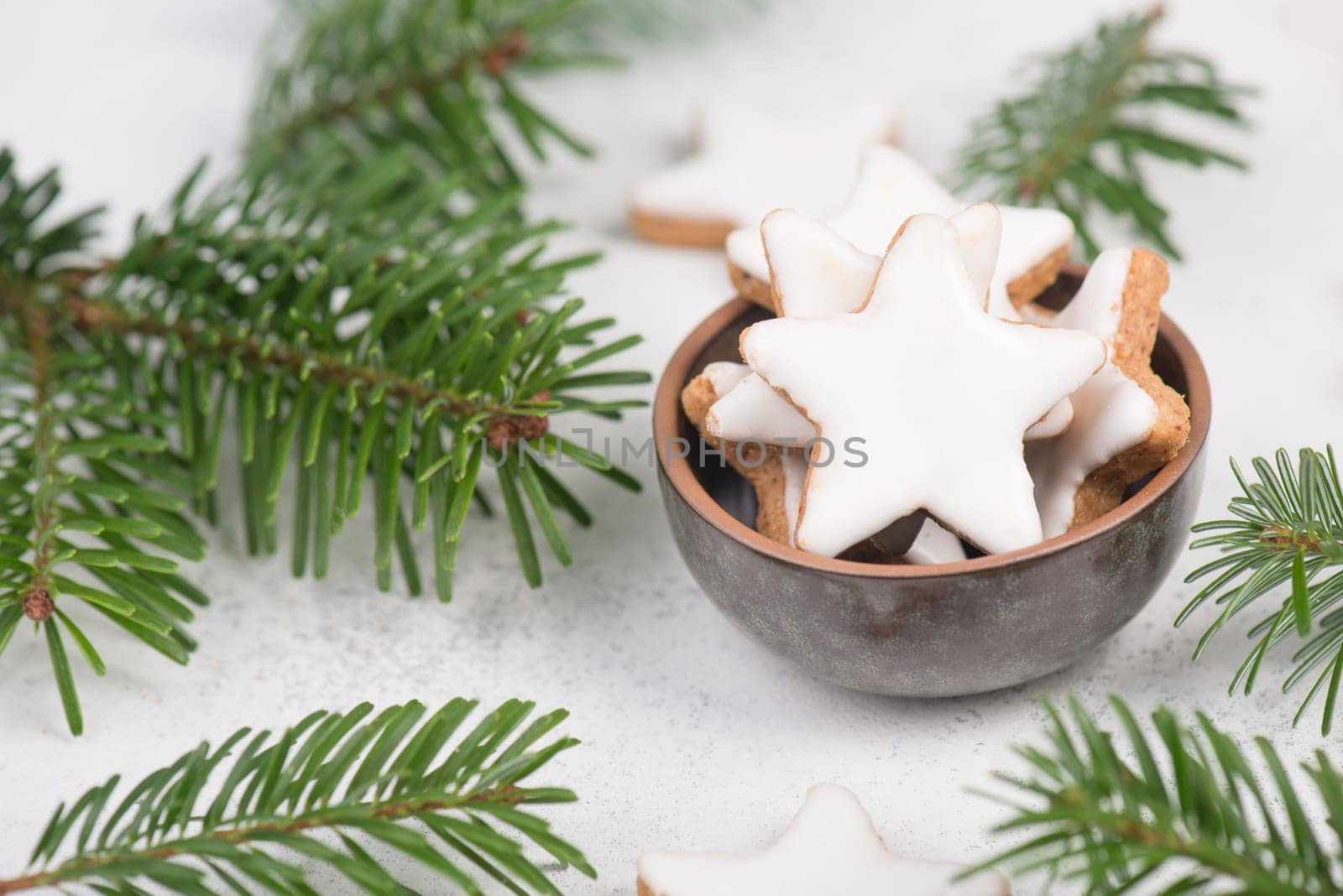 Cinnamon stars, traditional german christmas cookies, gingerbread, empty copy space, fir branch