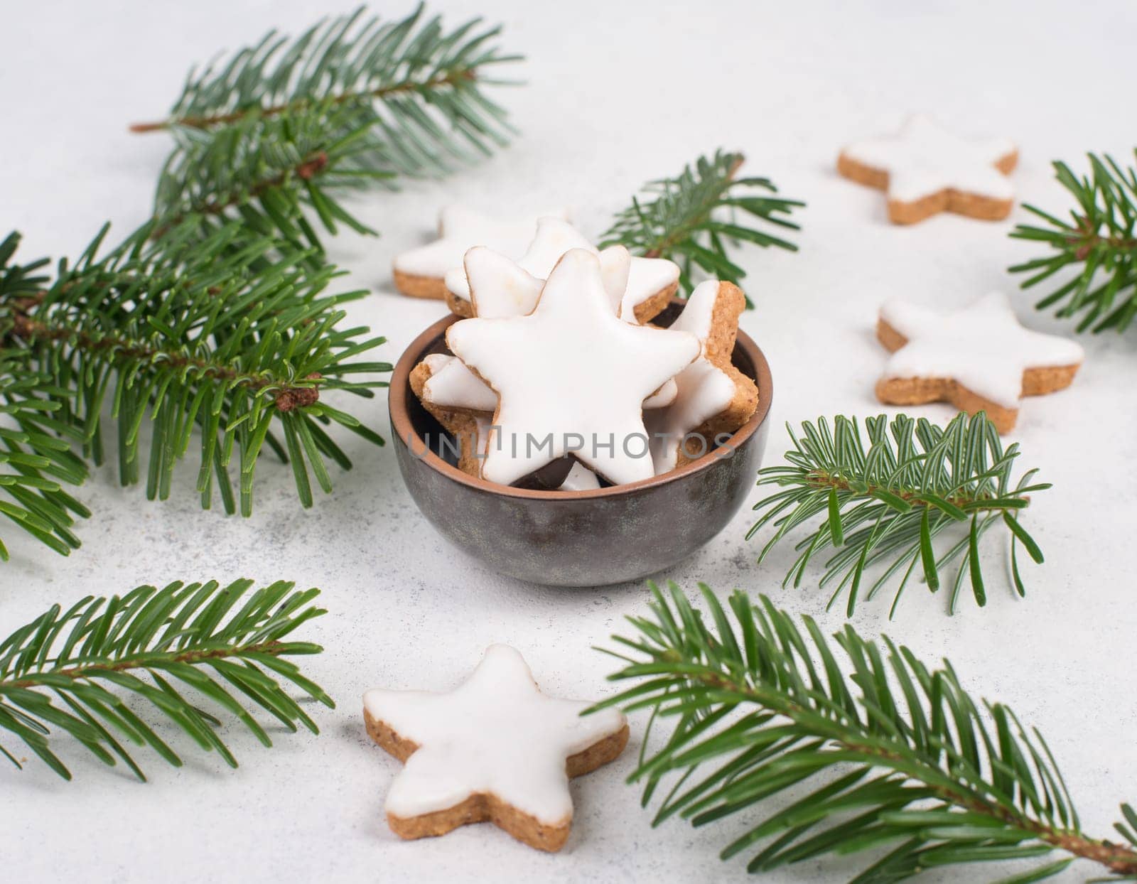 Cinnamon stars, traditional german christmas cookies, gingerbread, empty copy space, fir branch