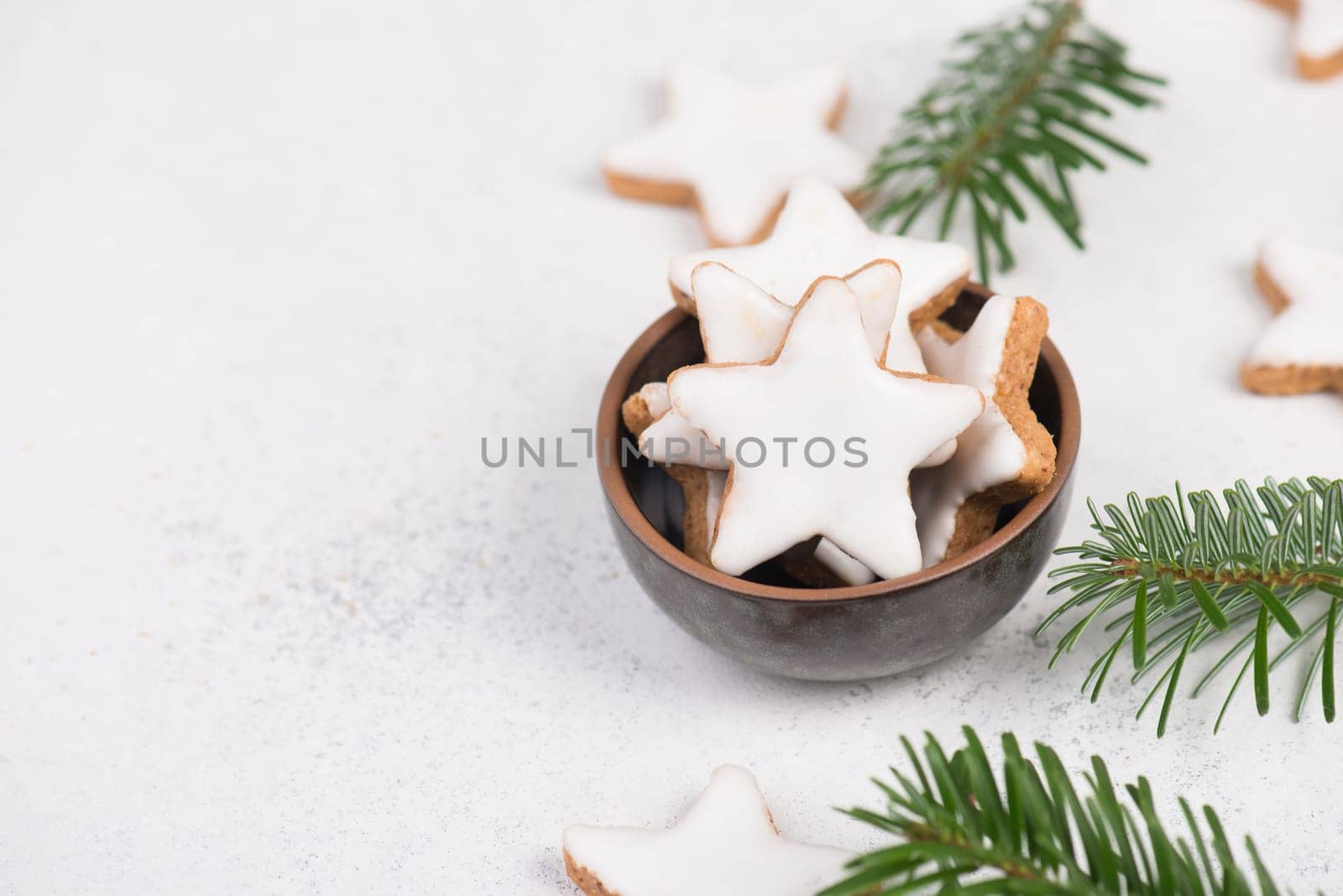 Cinnamon stars, traditional german christmas cookies, gingerbread, empty copy space, fir branch