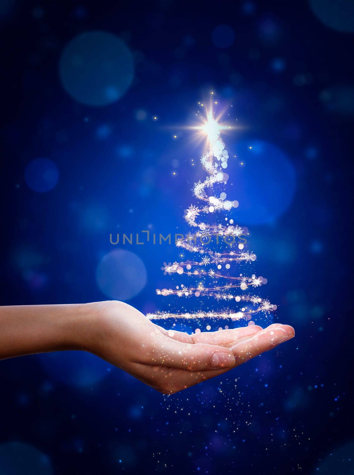 Blue Christmas tree in hand. Christmas Tree, beautiful lights, stars and snowflakes