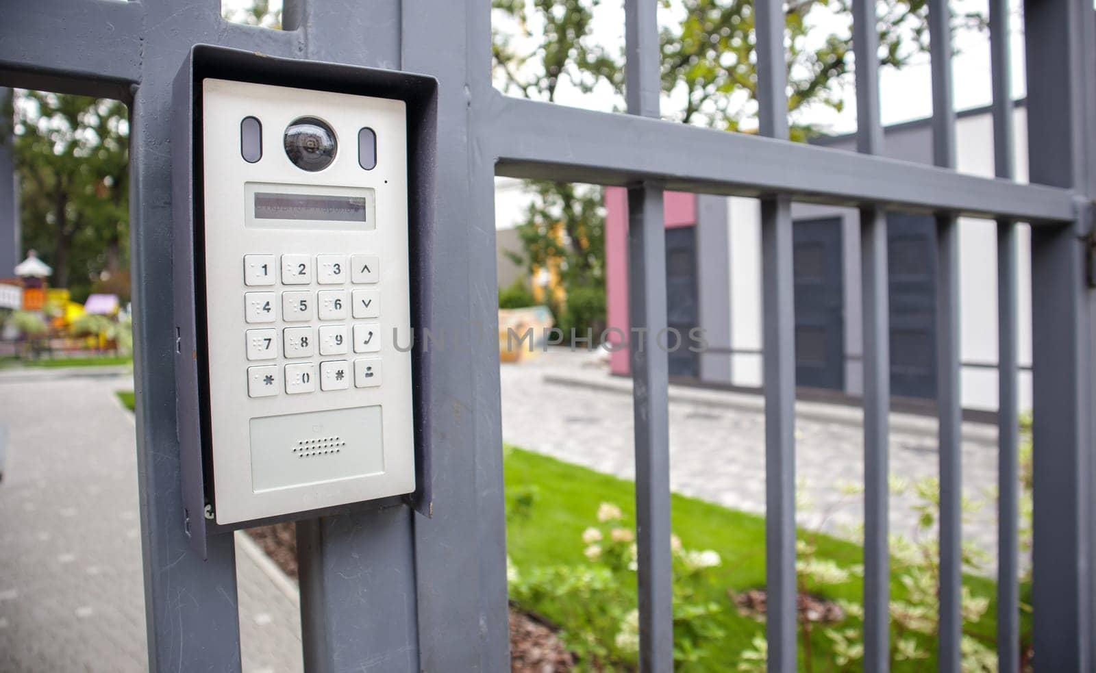 Video intercom on the gate at the entrance to the residential area. Electronic intercom to a private area. closed residential yard