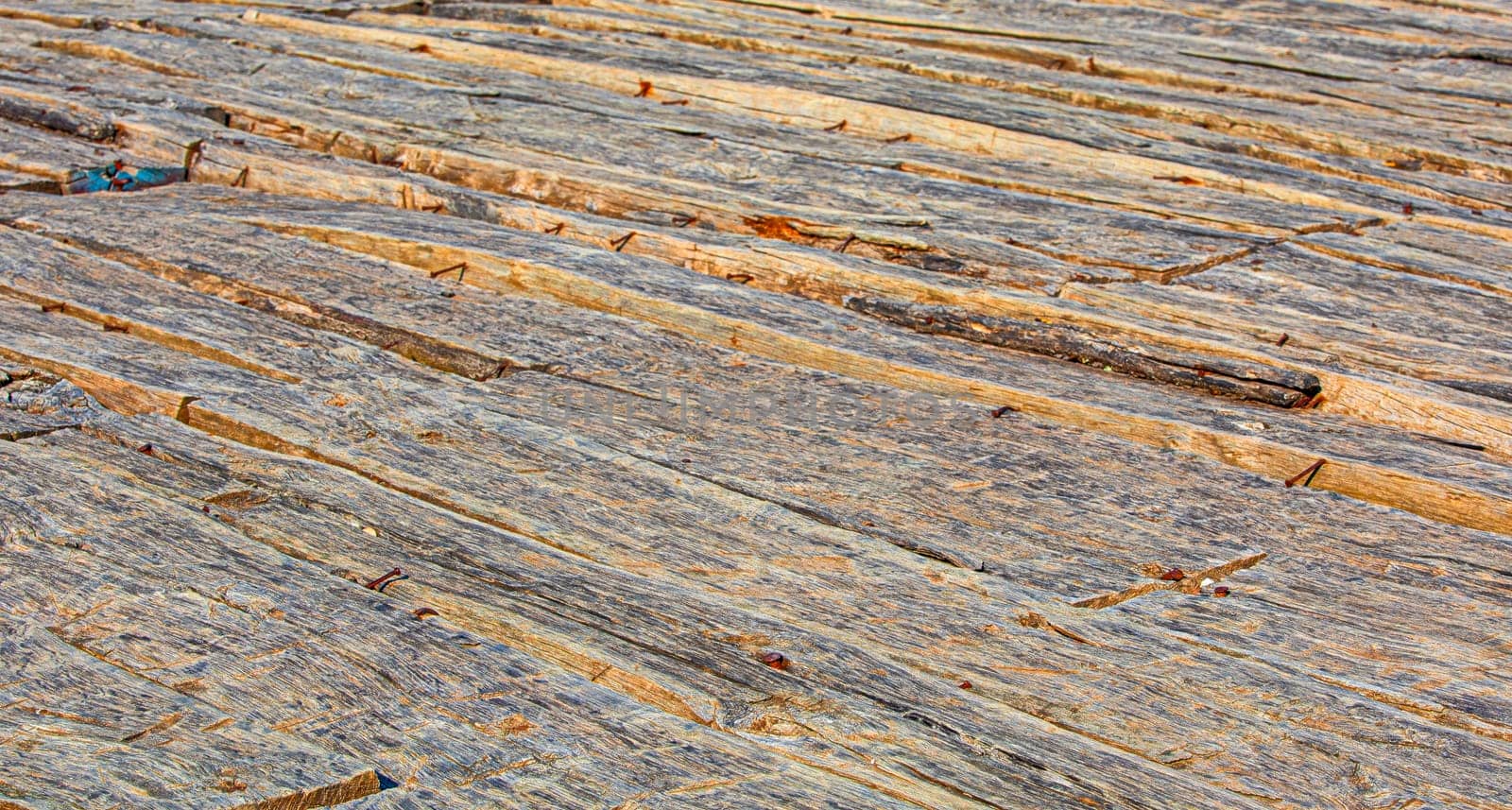 The background of an old natural wood room with messy and grungy floor texture inside empty neglected