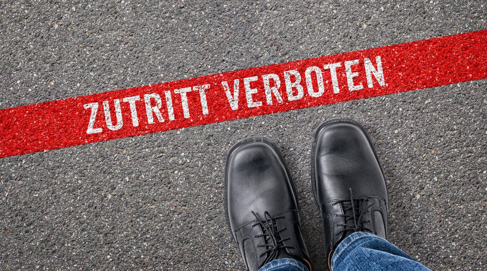 Red line on asphalt - Do not enter in german - Zutritt verboten