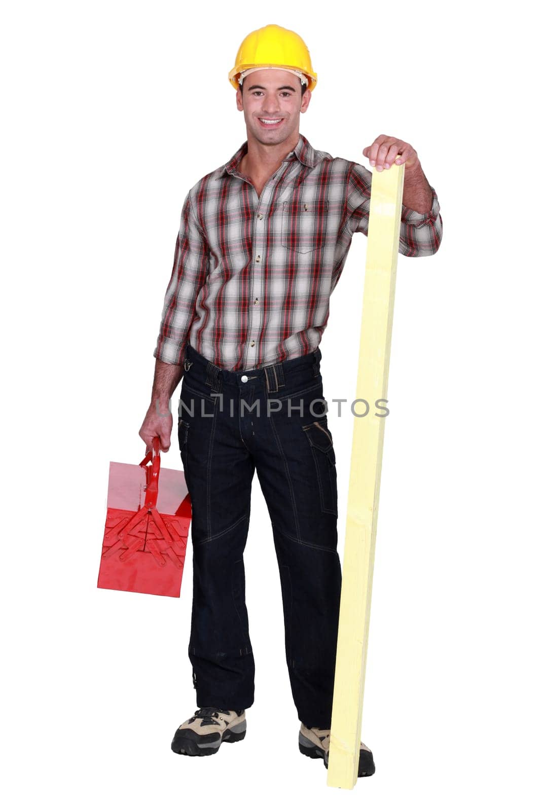 Confident carpenter standing on white background