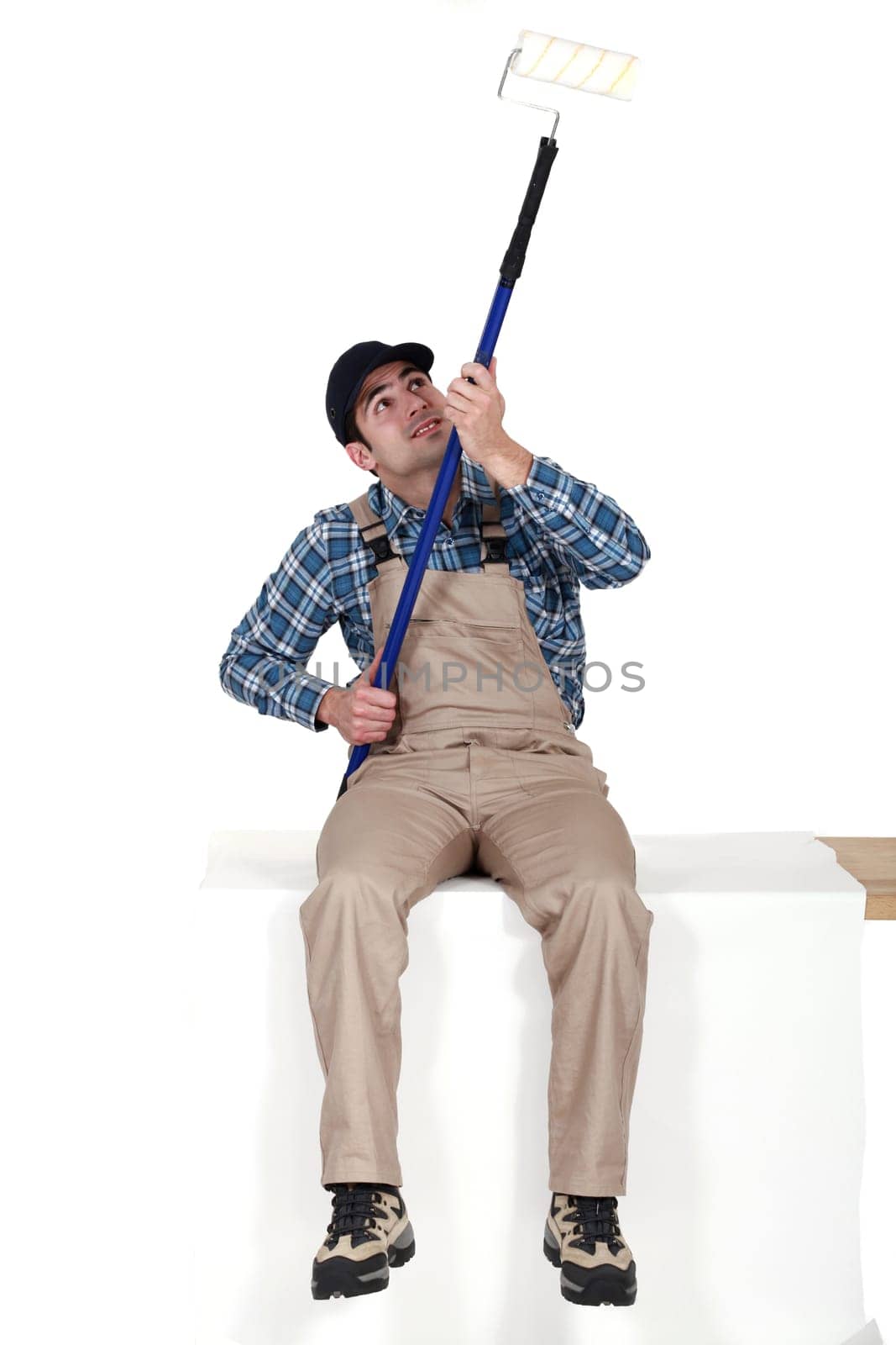 craftsman painting a ceiling