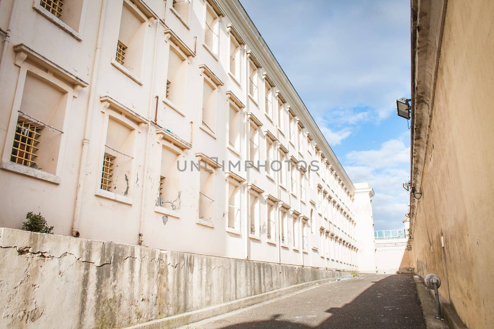 Row of windows with bars in old prison.