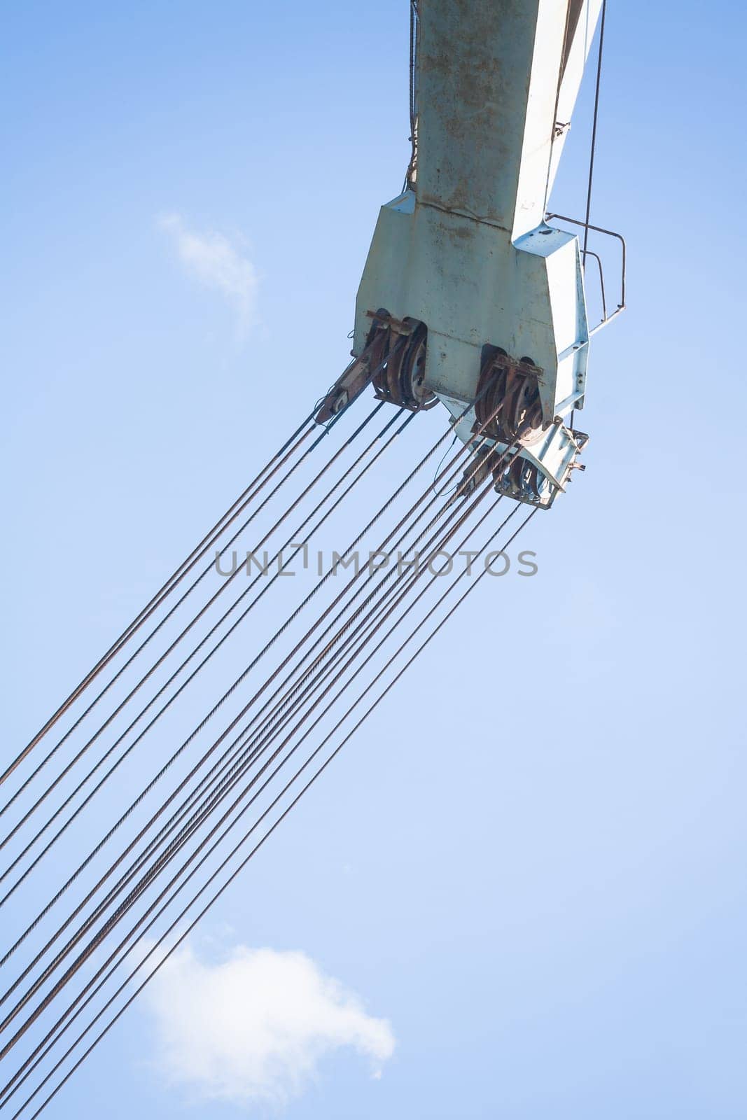 Old crane at the dock of the port