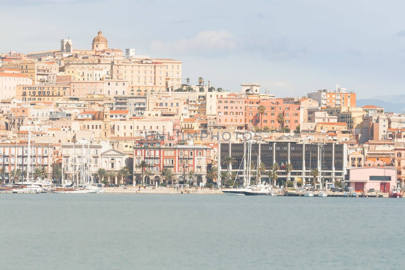 Cagliari , Seafront and Port. Roma Street and Palace of the Regional Council of Sardinia.