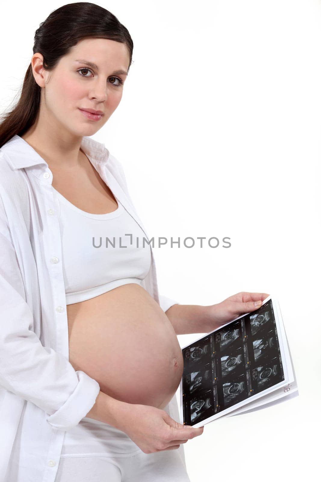 Pregnant woman holding scan