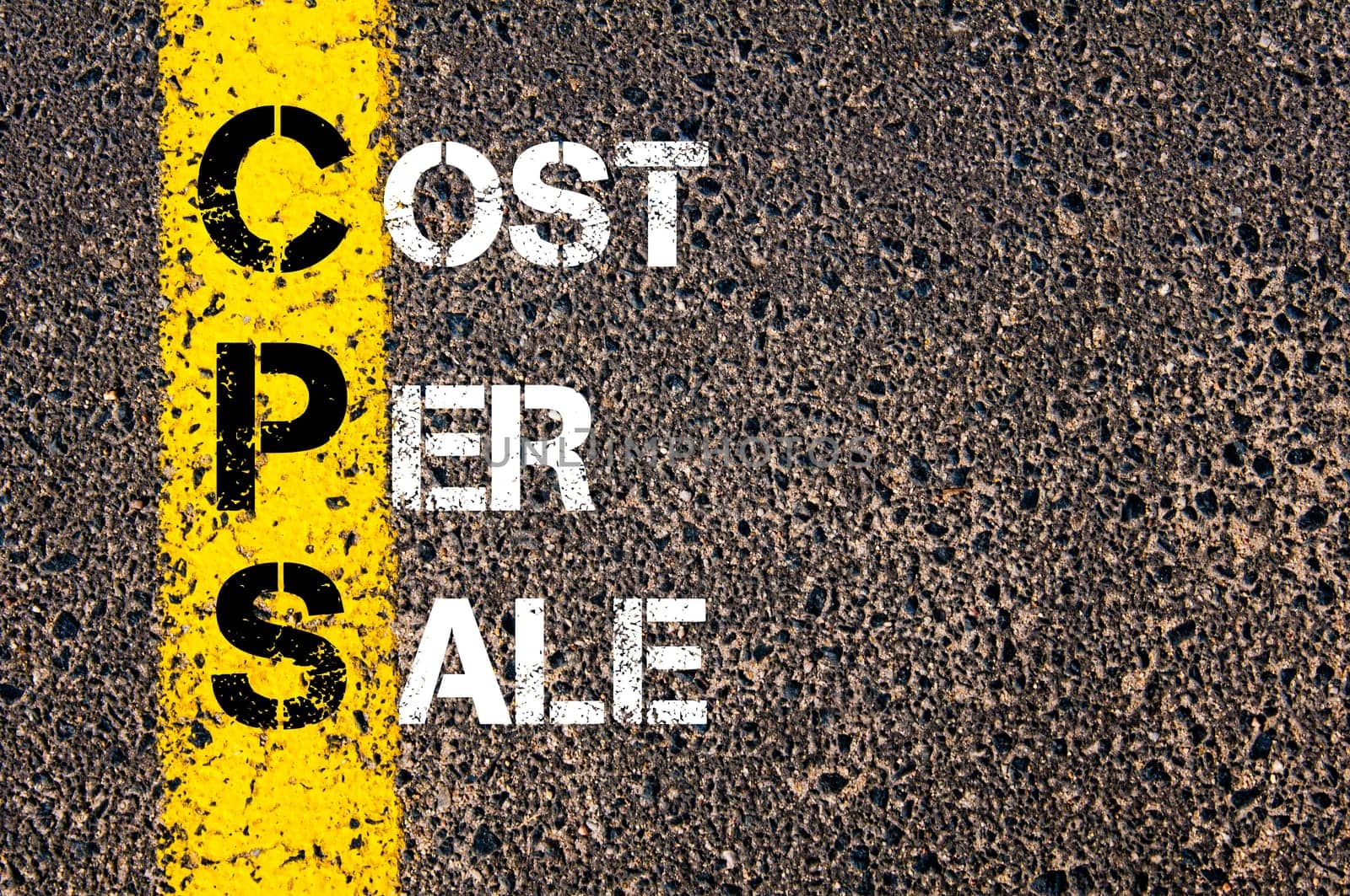 Acronym CPS - Cost Per Sale. Business Conceptual image with yellow paint line on the road over asphalt stone background.