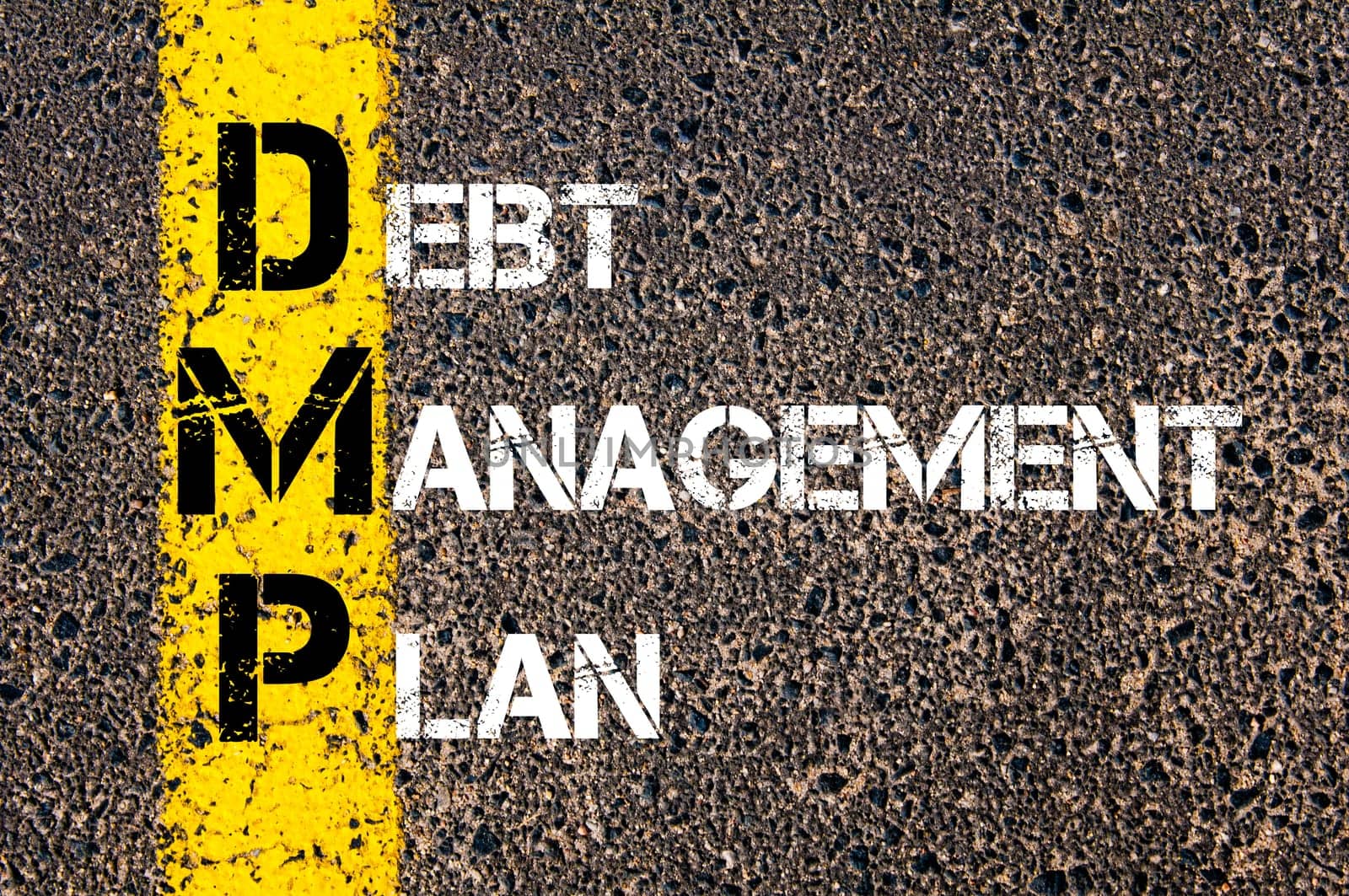 Acronym DMP - Debt Management Plan. Business Conceptual image with yellow paint line on the road over asphalt stone background.
