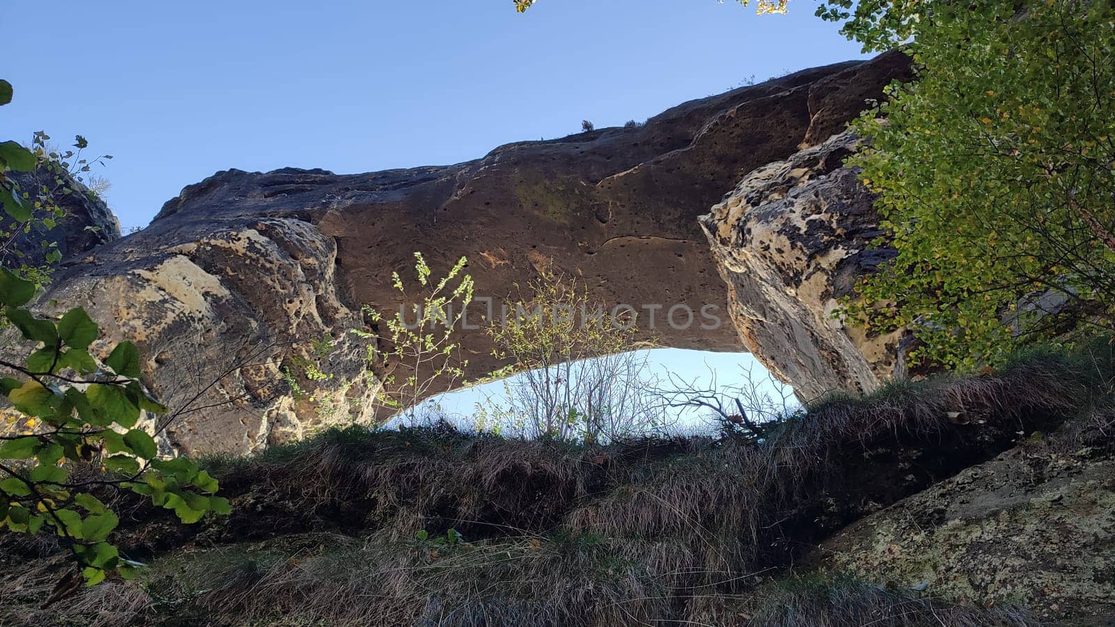 Rocky natural arch nature travel background landscape summer day park sky Czech Republic Europe Hrensko . High quality photo
