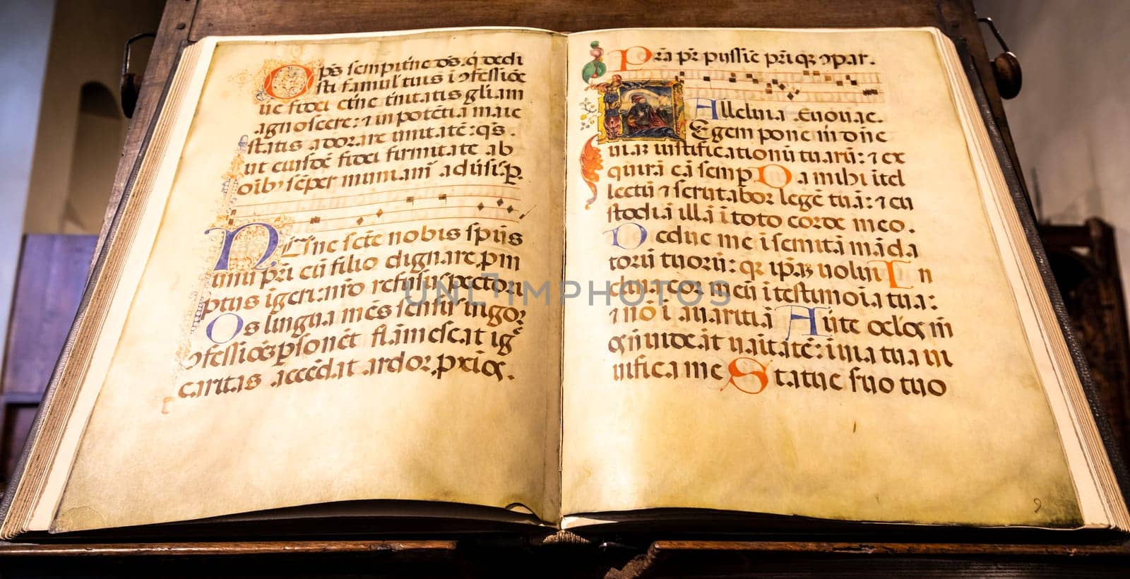 TURIN, ITALY - CIRCA MAY 2021: antique Medieval manuscript with ancient calligraphy.