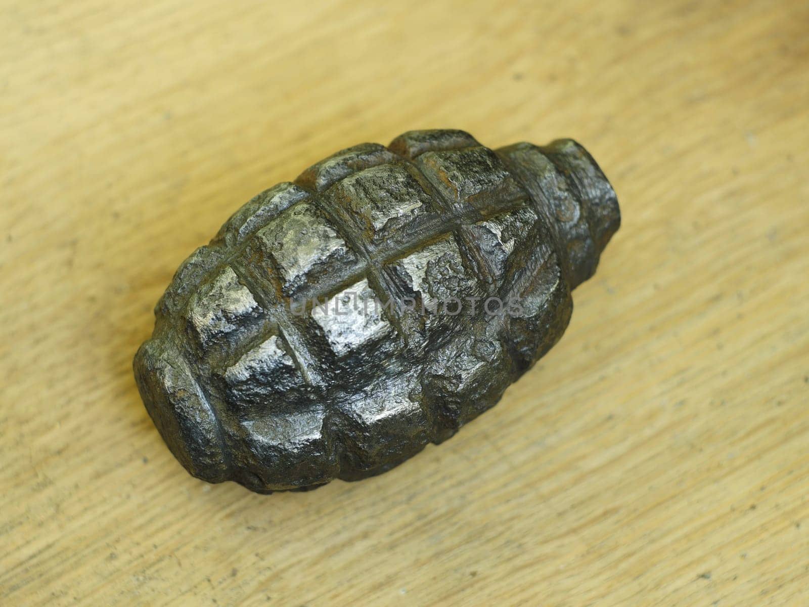 old rusty hand grenade military artifact close-up