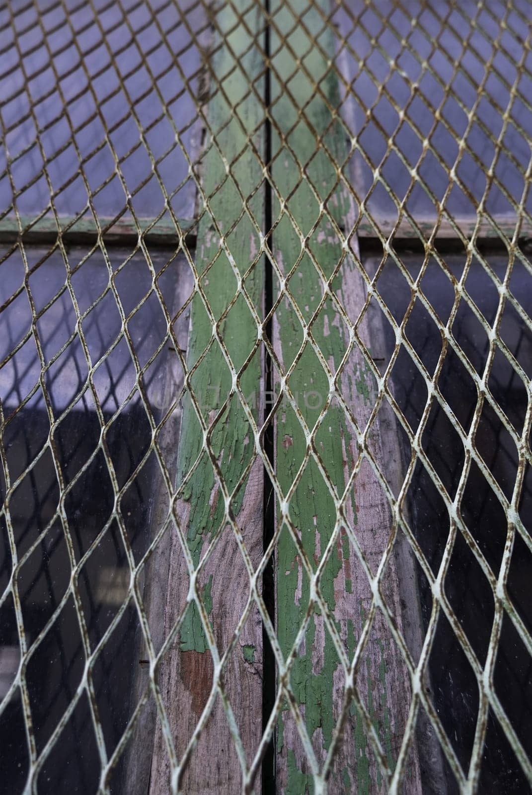 Detail of metal protection fence decorated, painted steel with shapes