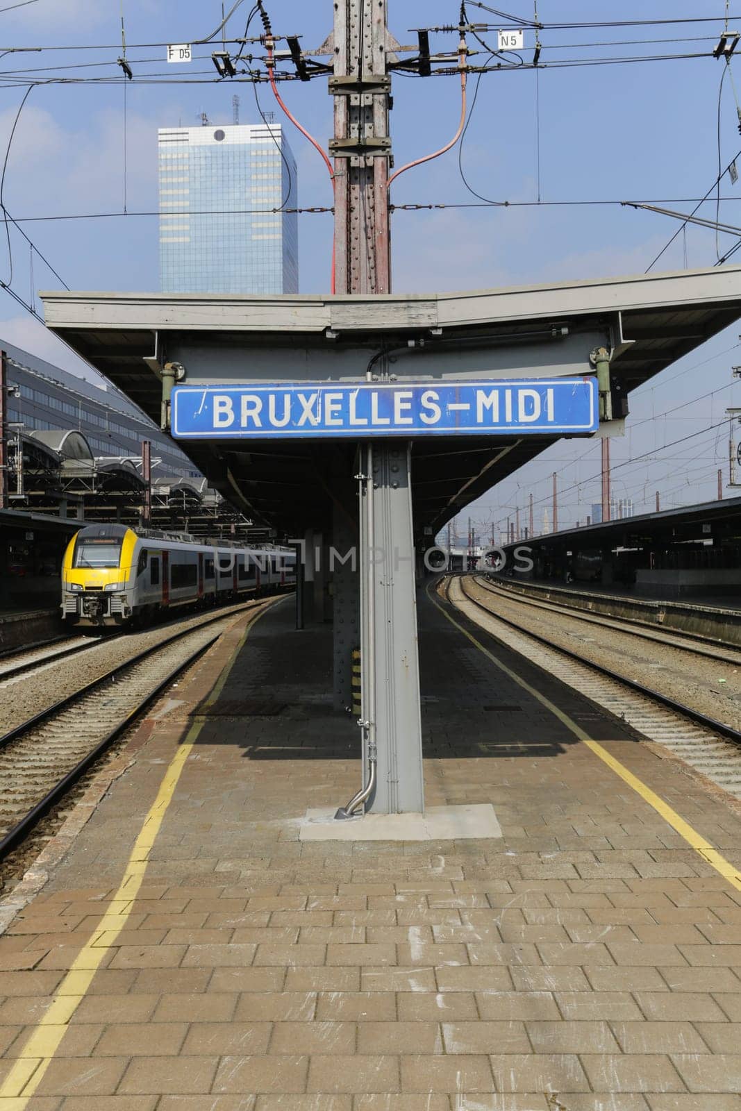 Rail tracks and trains in the Brussels South Railway Station