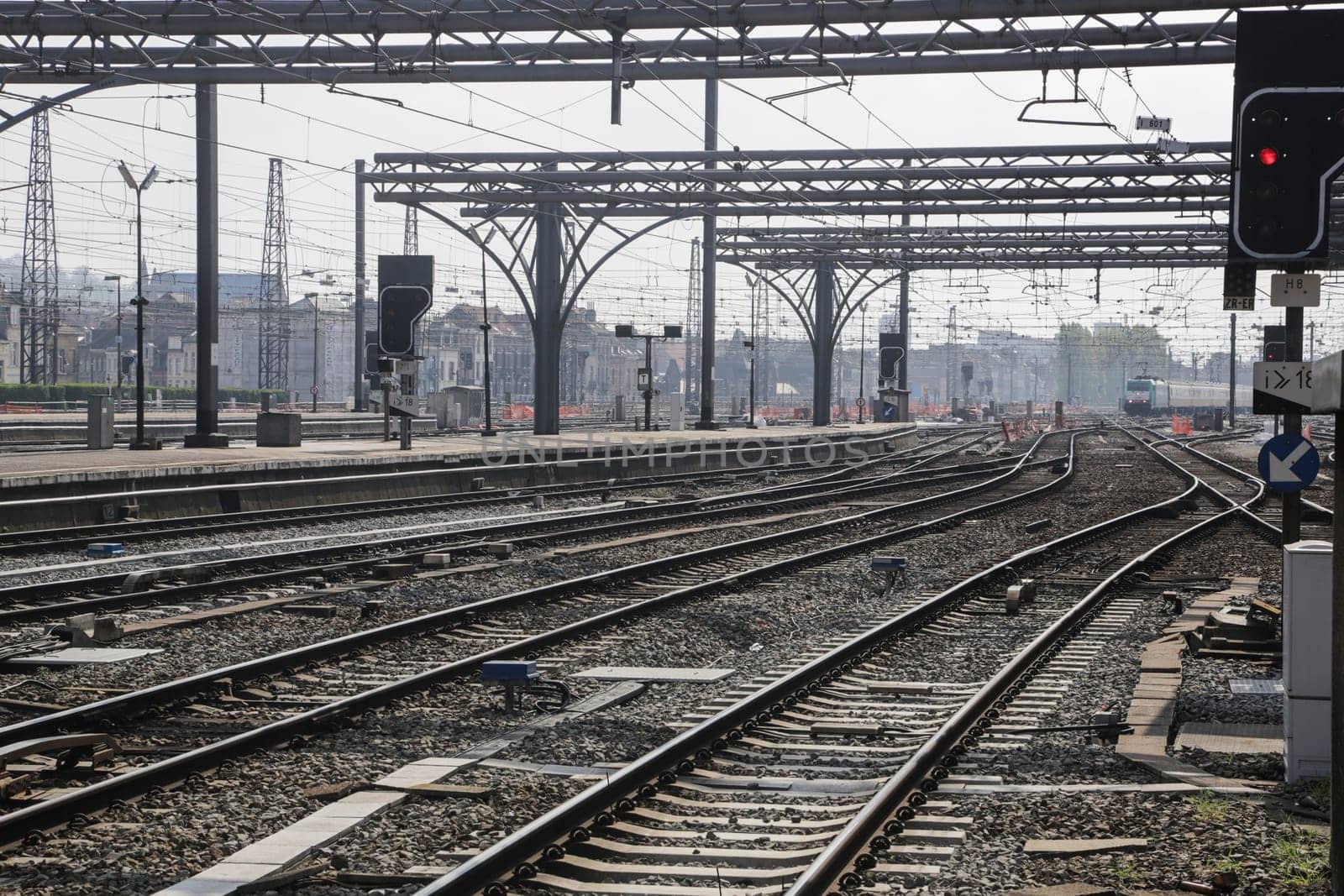 Rail tracks and trains in the Brussels South Railway Station