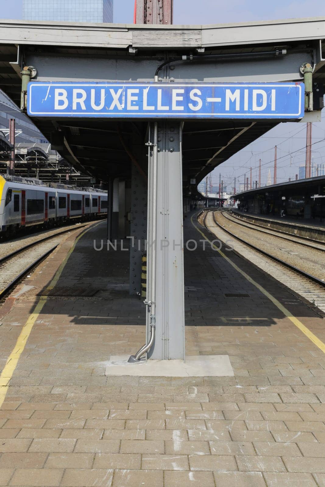 Rail tracks and trains in the Brussels South Railway Station